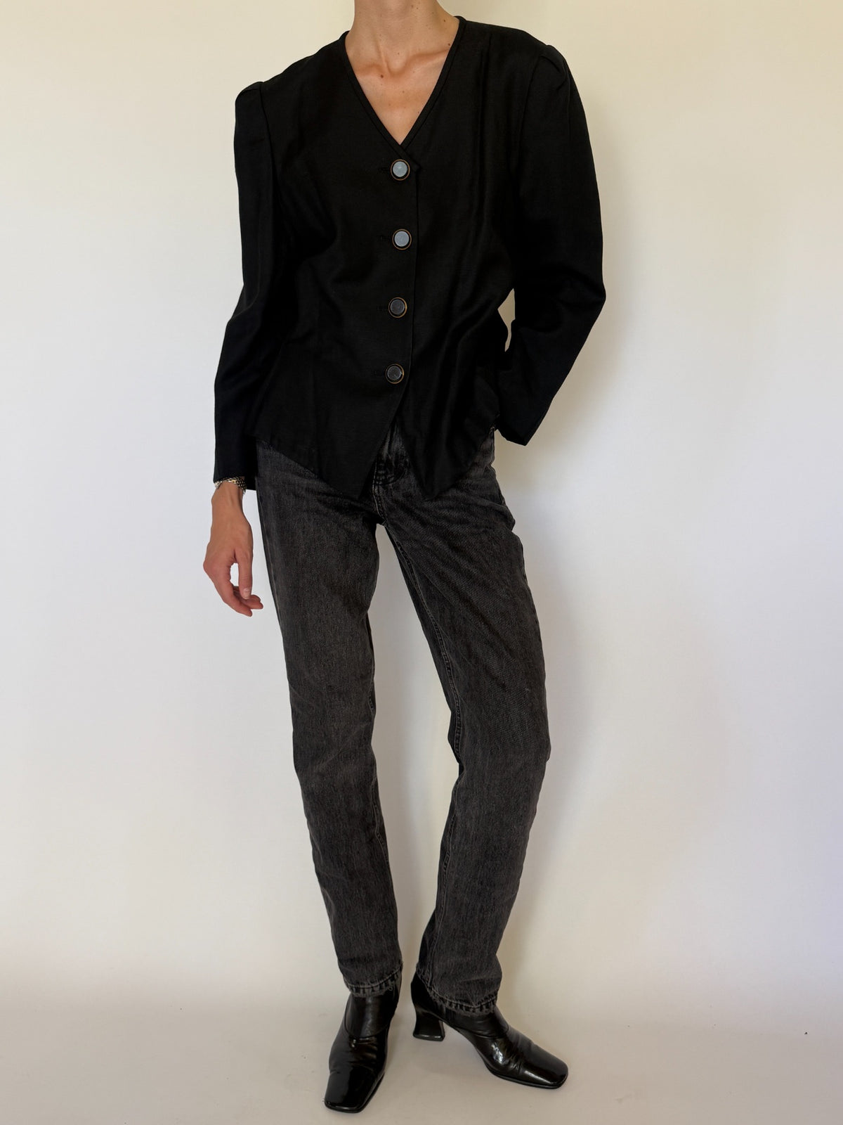 Angled front view of black blazer