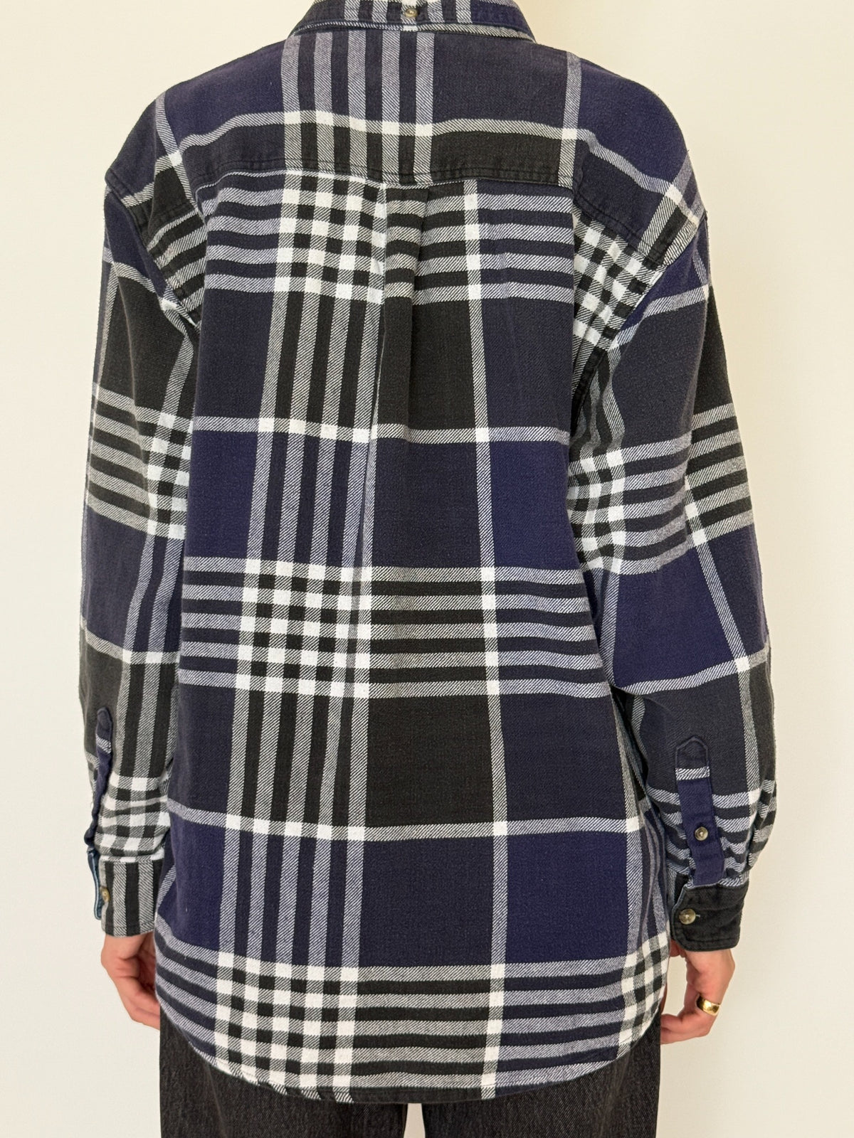 Front view of vintage oversized navy black and white plaid flannel shirt