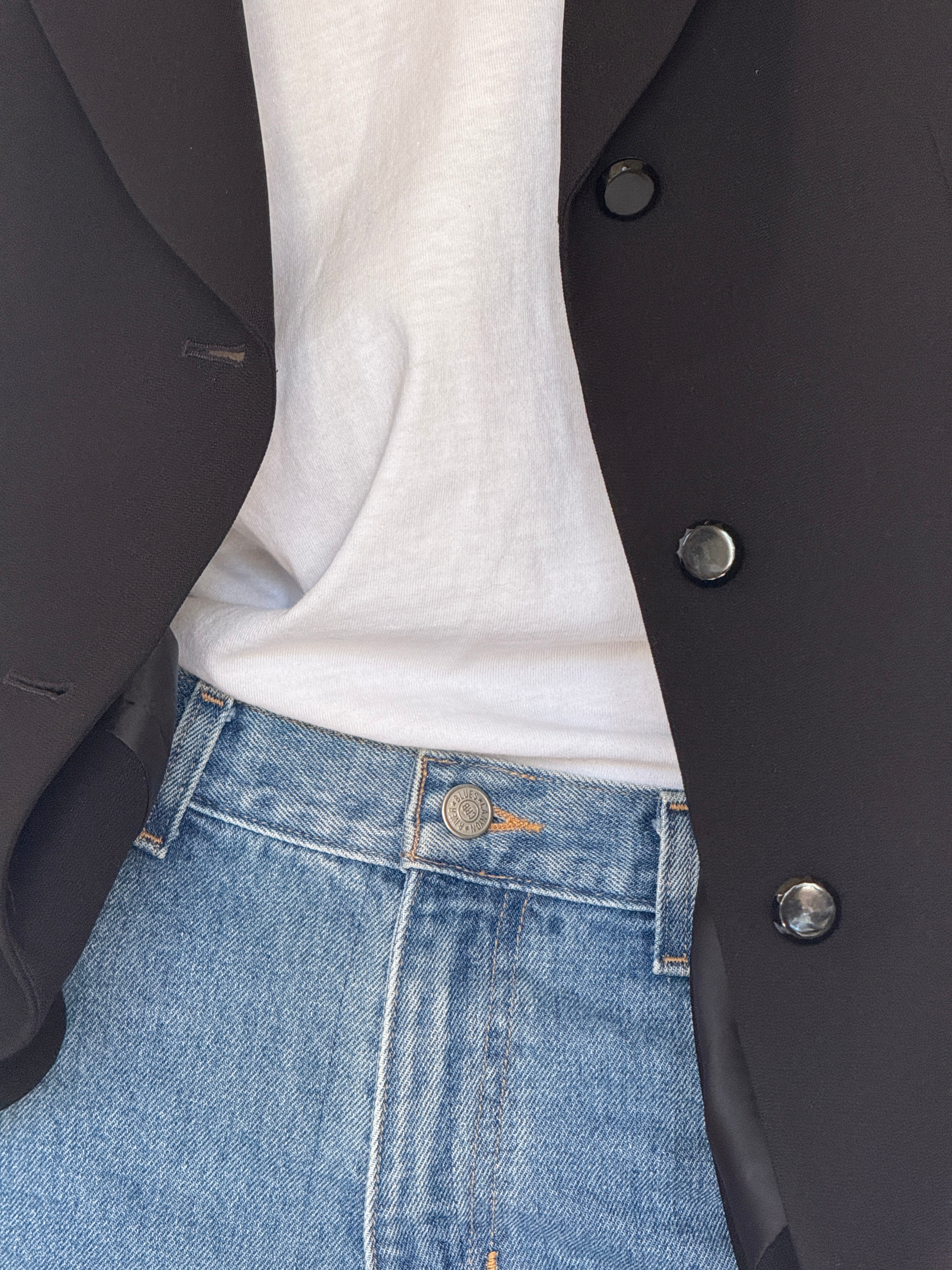 Vintage black blazer fabric close-up