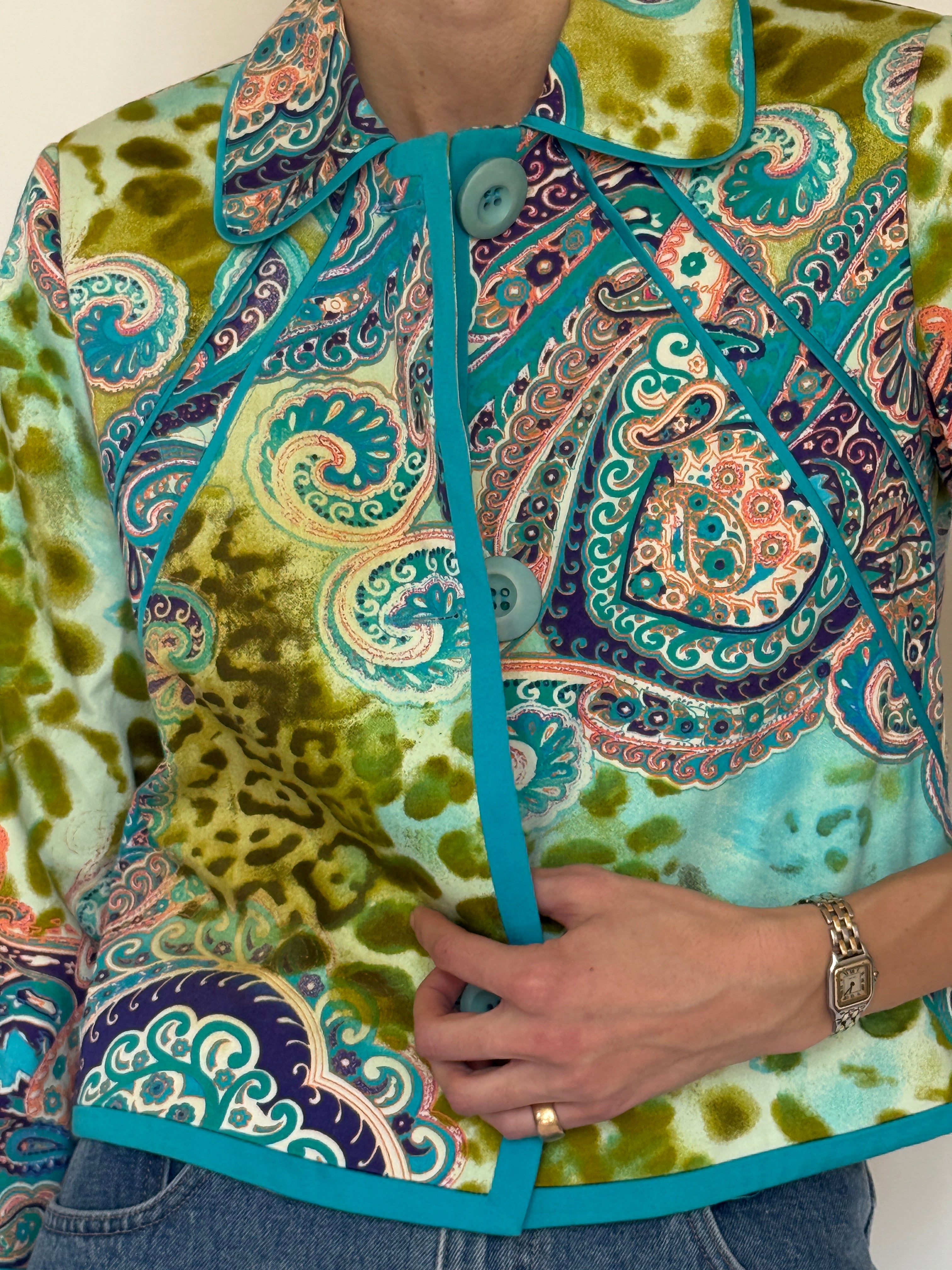 Vintage paisley print jacket fabric close-up turquoise and green pattern