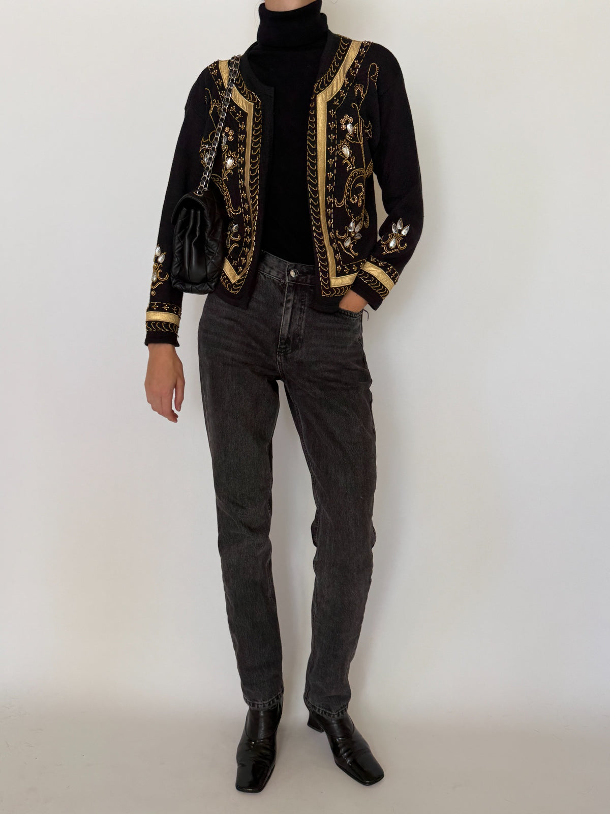 Detailed view of gold beading on cardigan front