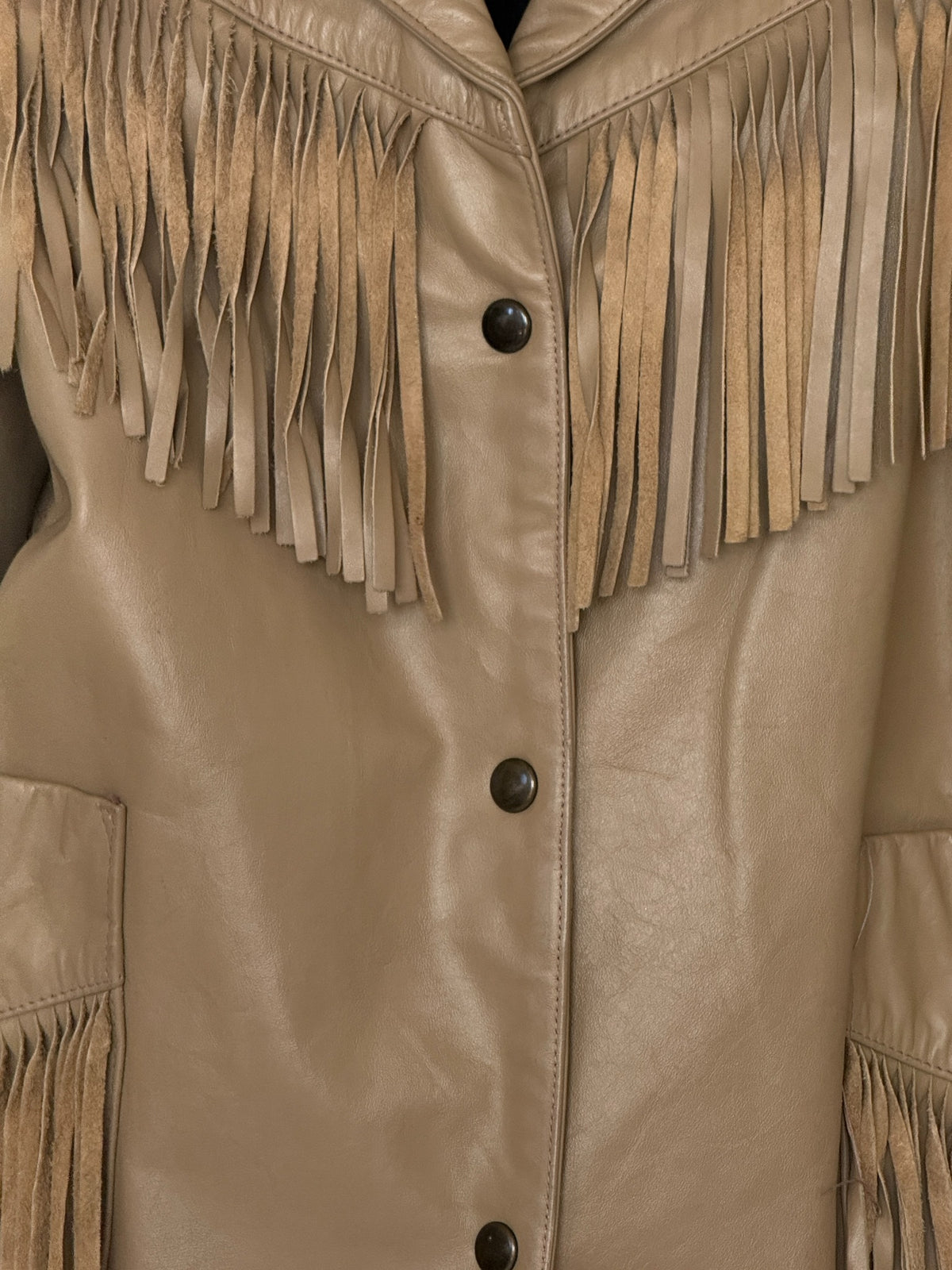 Front detail of tan leather Western jacket