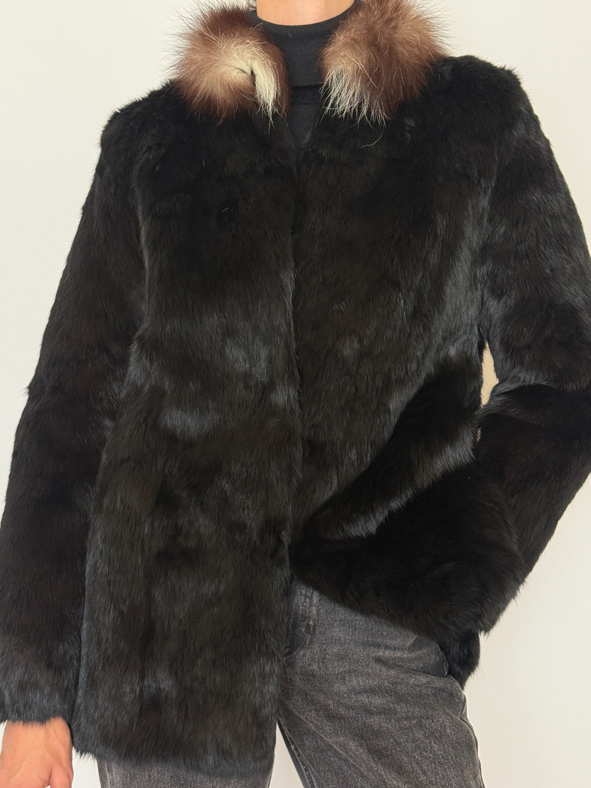 Front angle of vintage black fur jacket