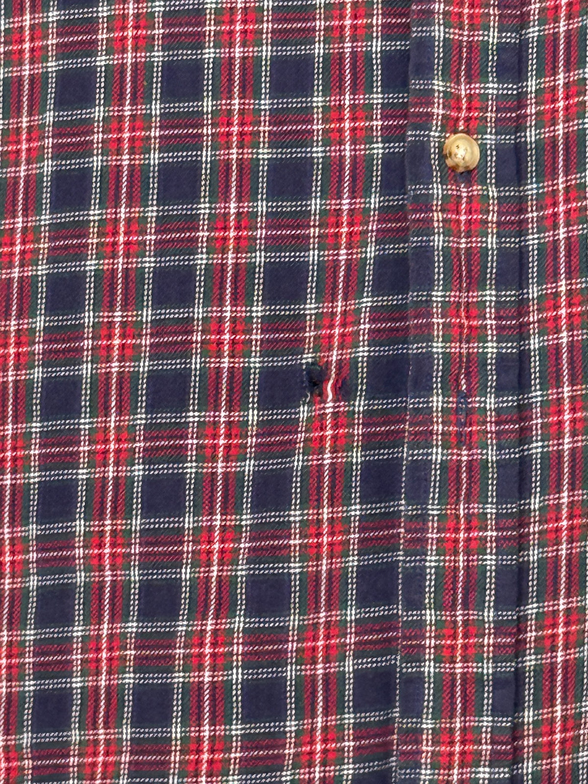 Small hole beside button on left side