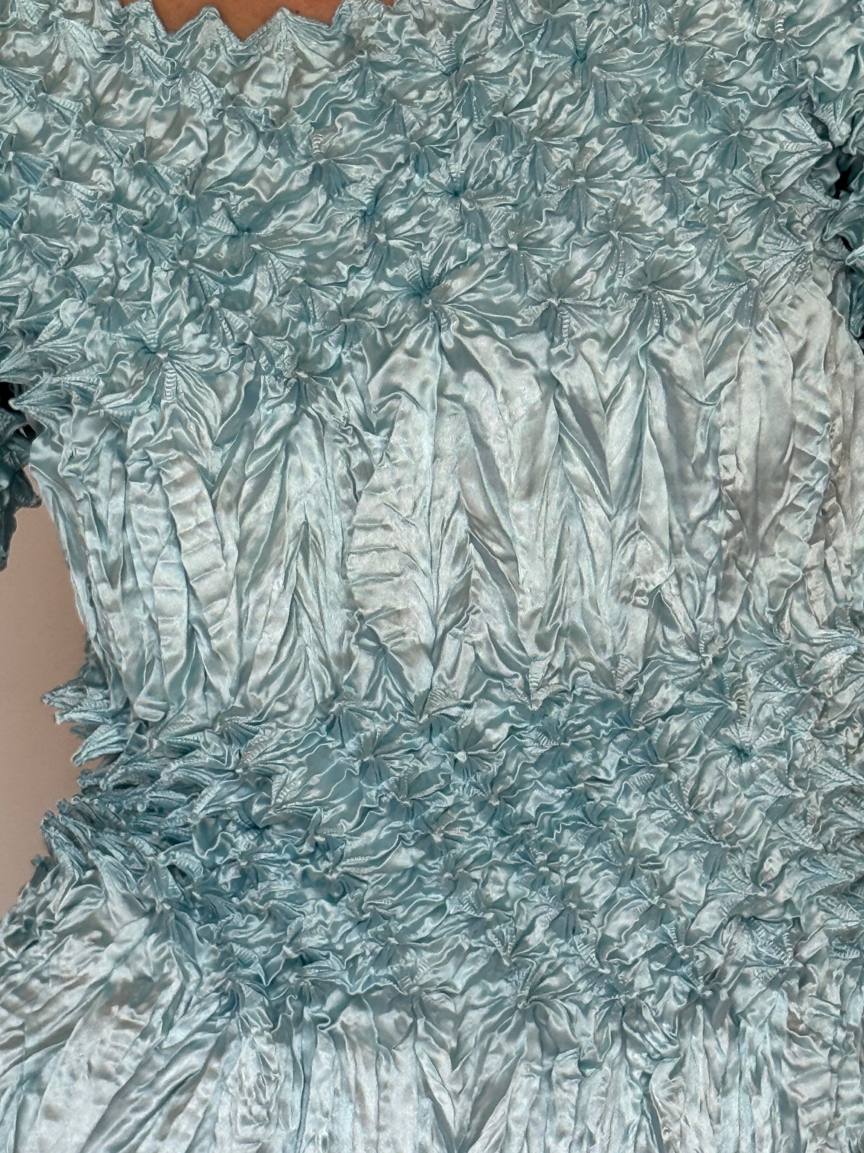 Vintage light blue popcorn textured top fabric close-up