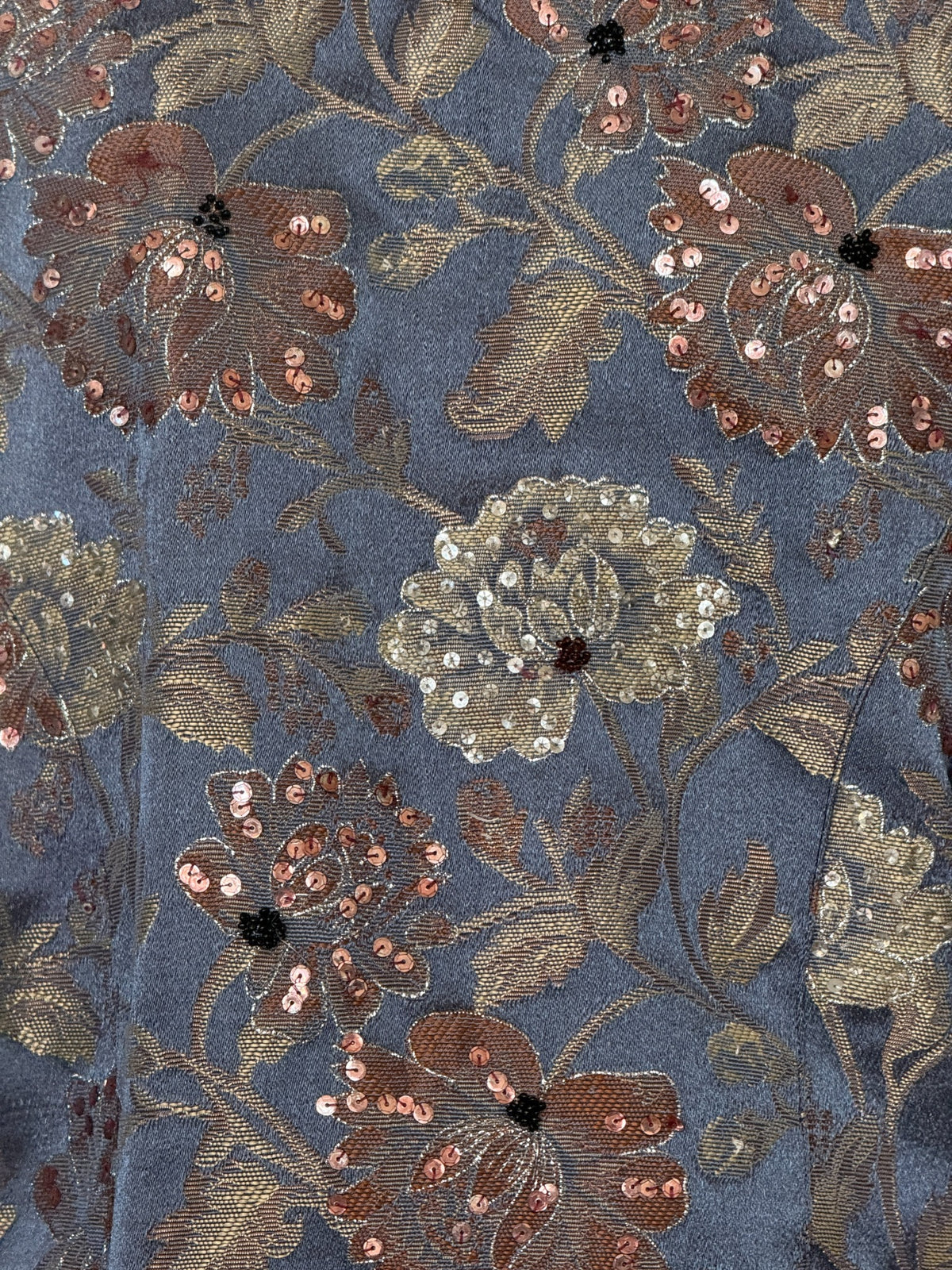 Vintage floral brocade jacket fabric close-up