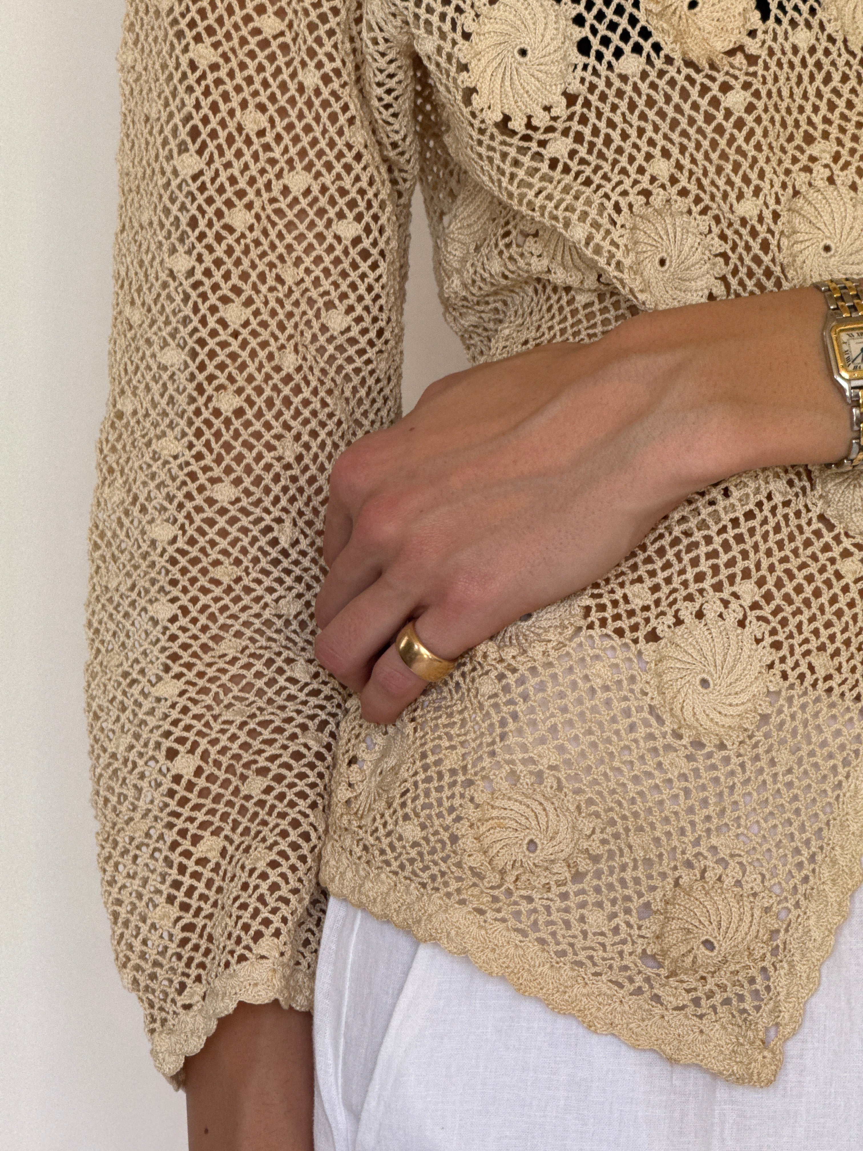 Vintage cream crochet jacket fabric close-up