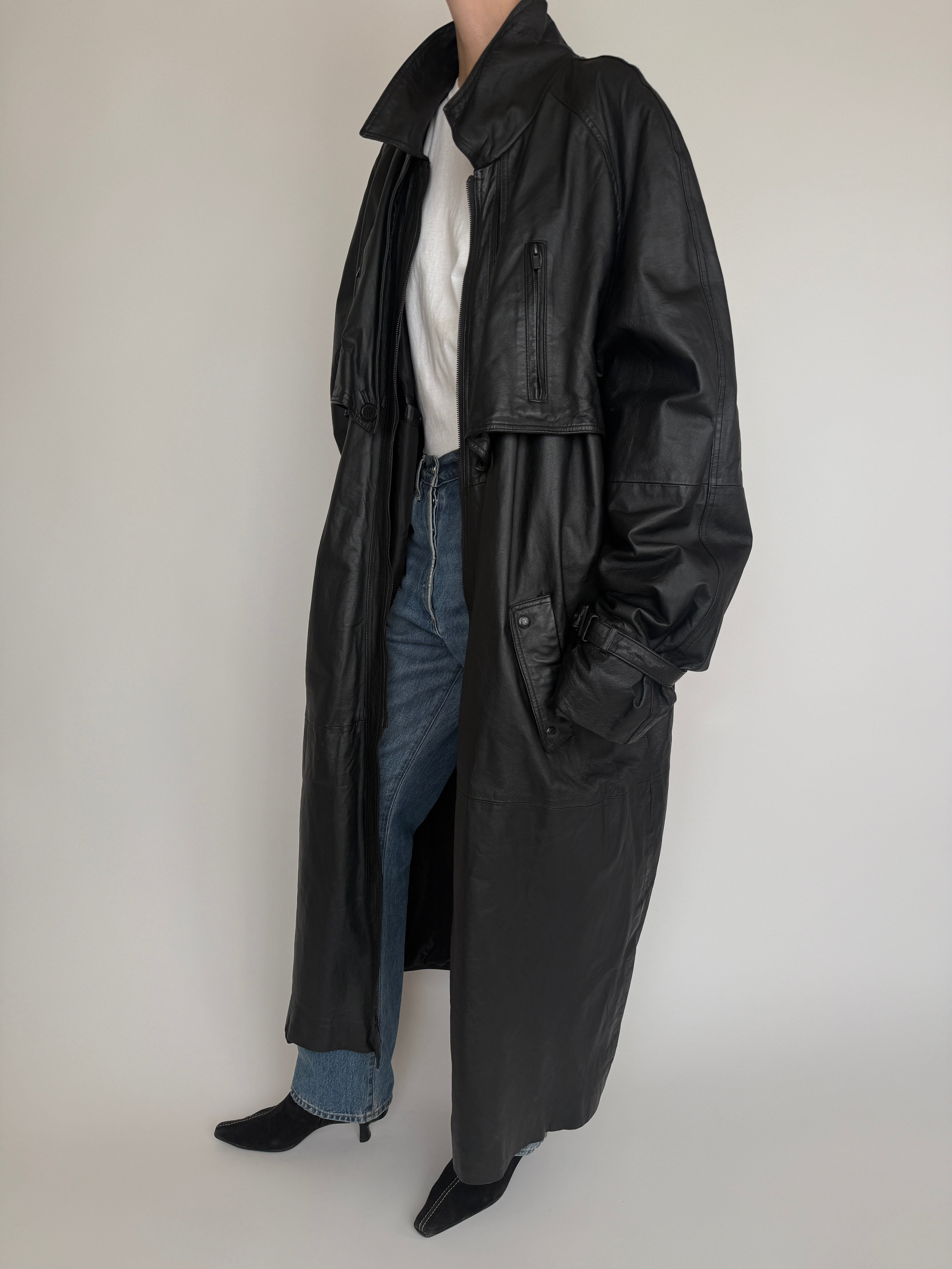 Vintage black long leather coat side view