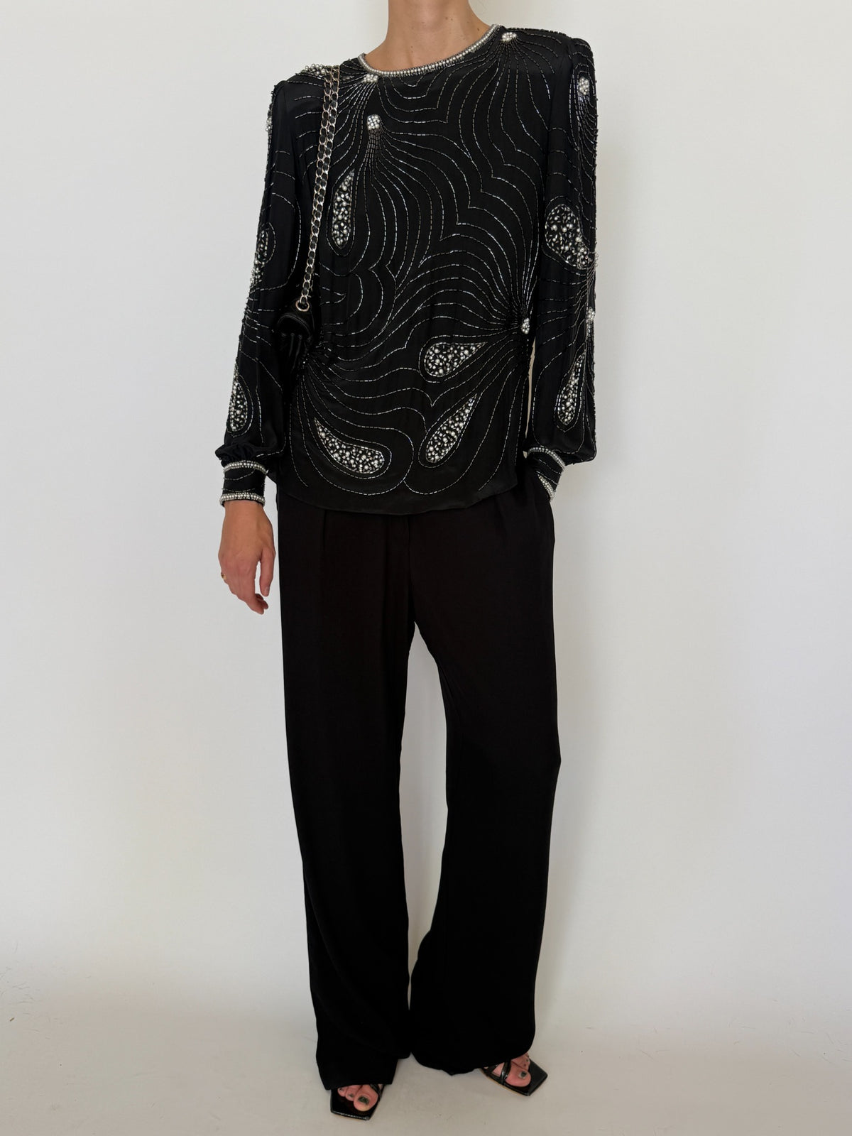 Full front view of black silk beaded evening blouse