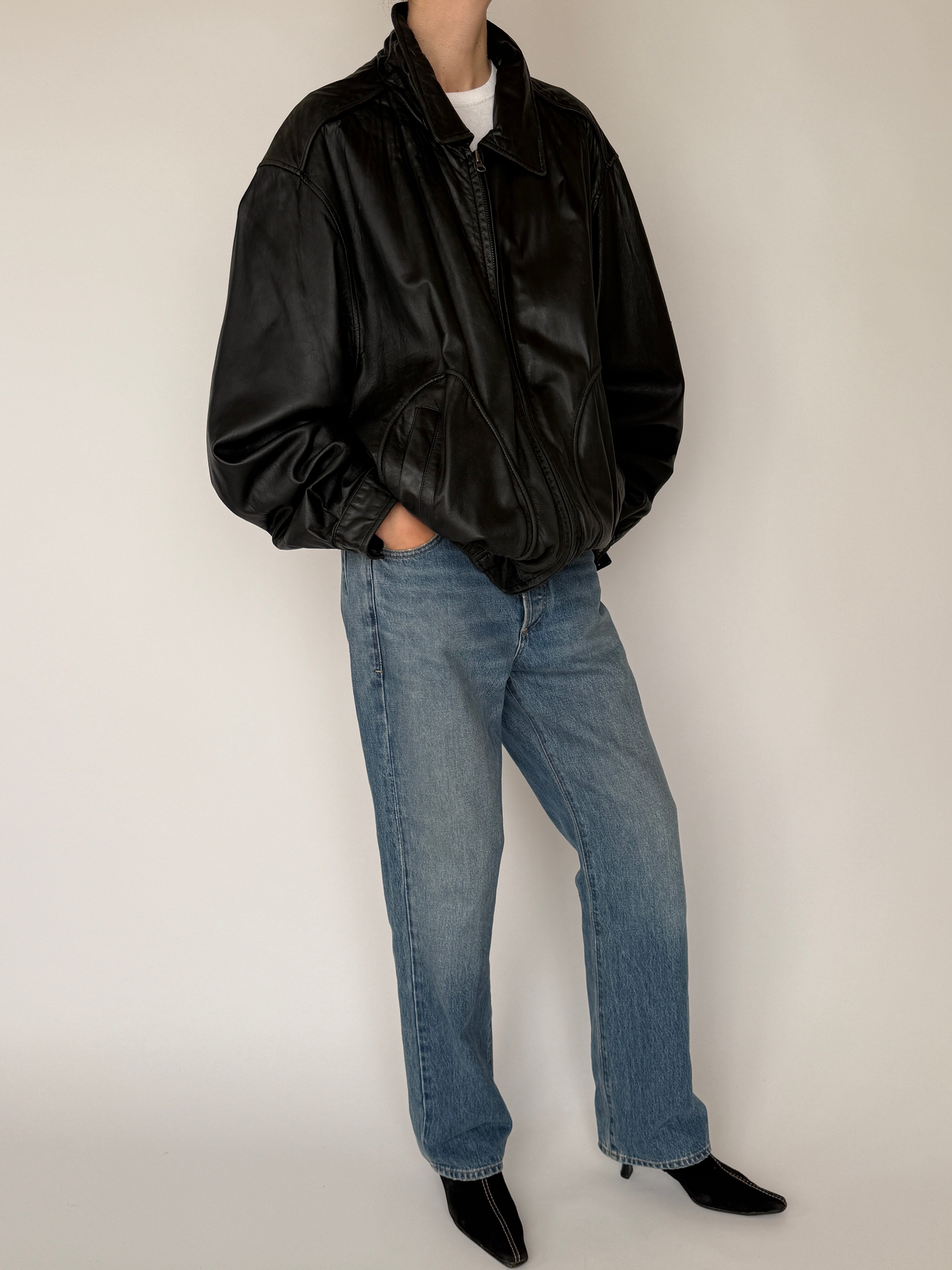 Vintage black leather bomber jacket zipper detail front closure