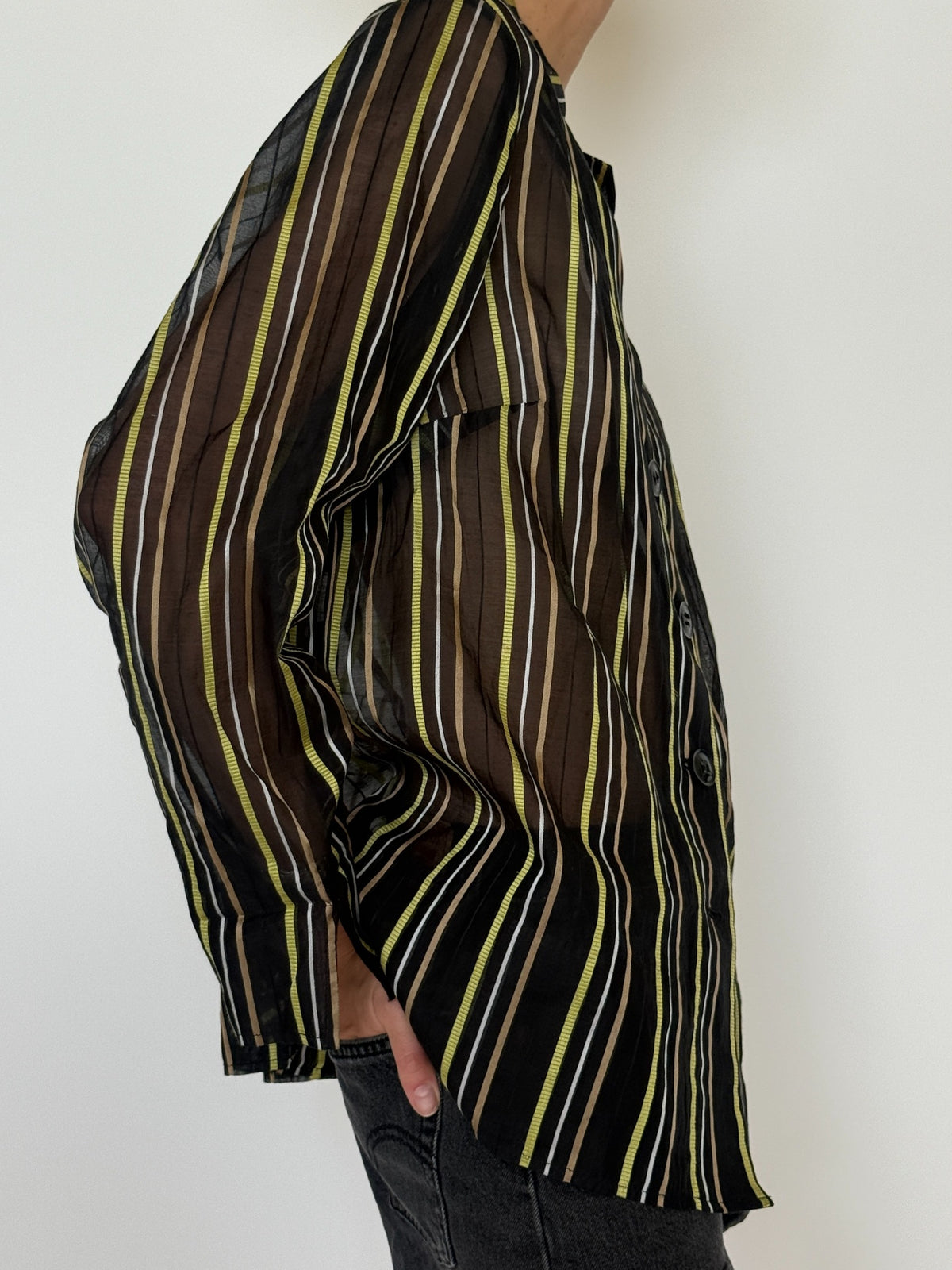 Back angled view of vintage black brown green striped cotton silk shirt