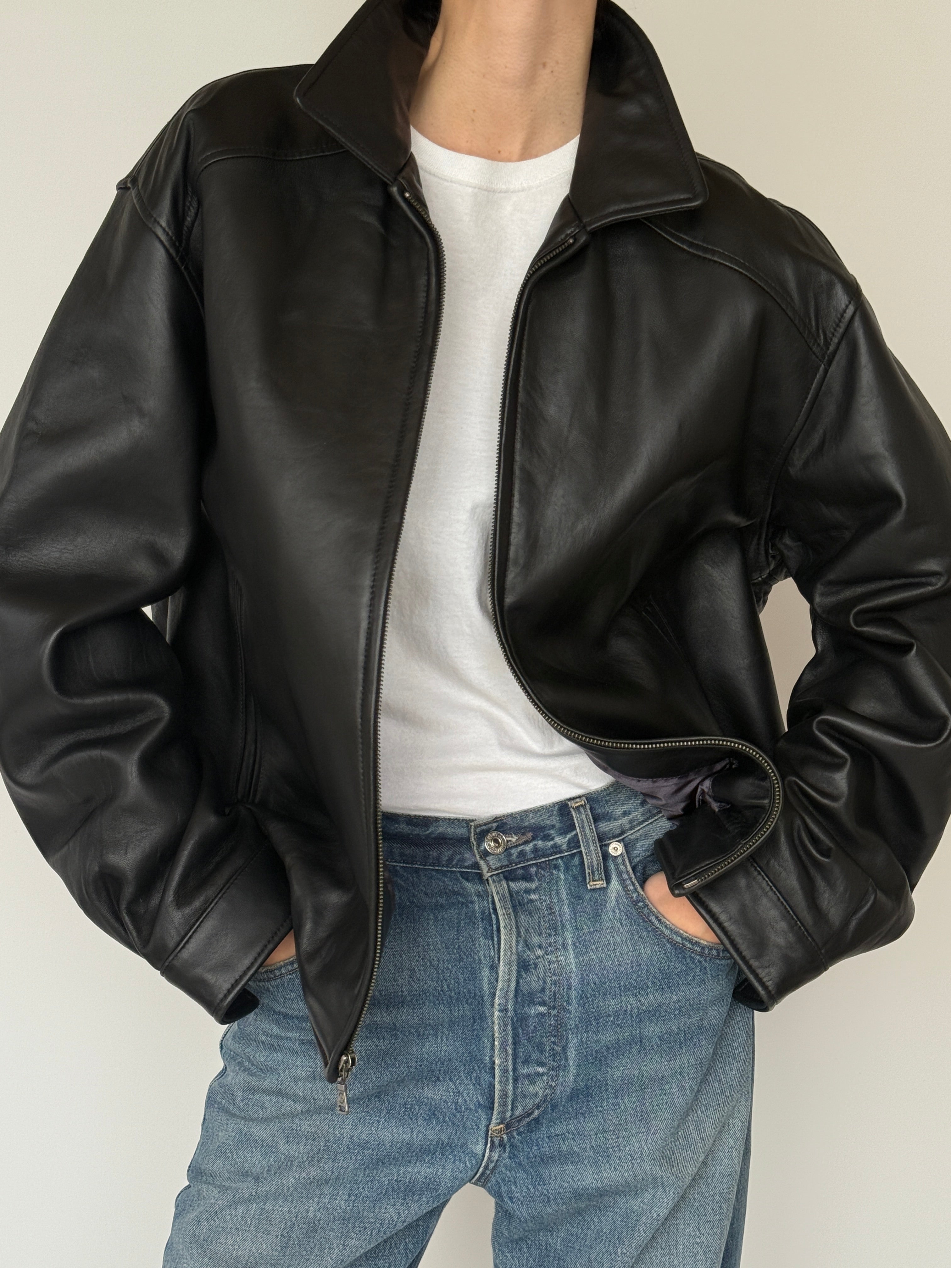 Vintage black leather jacket leather texture close-up