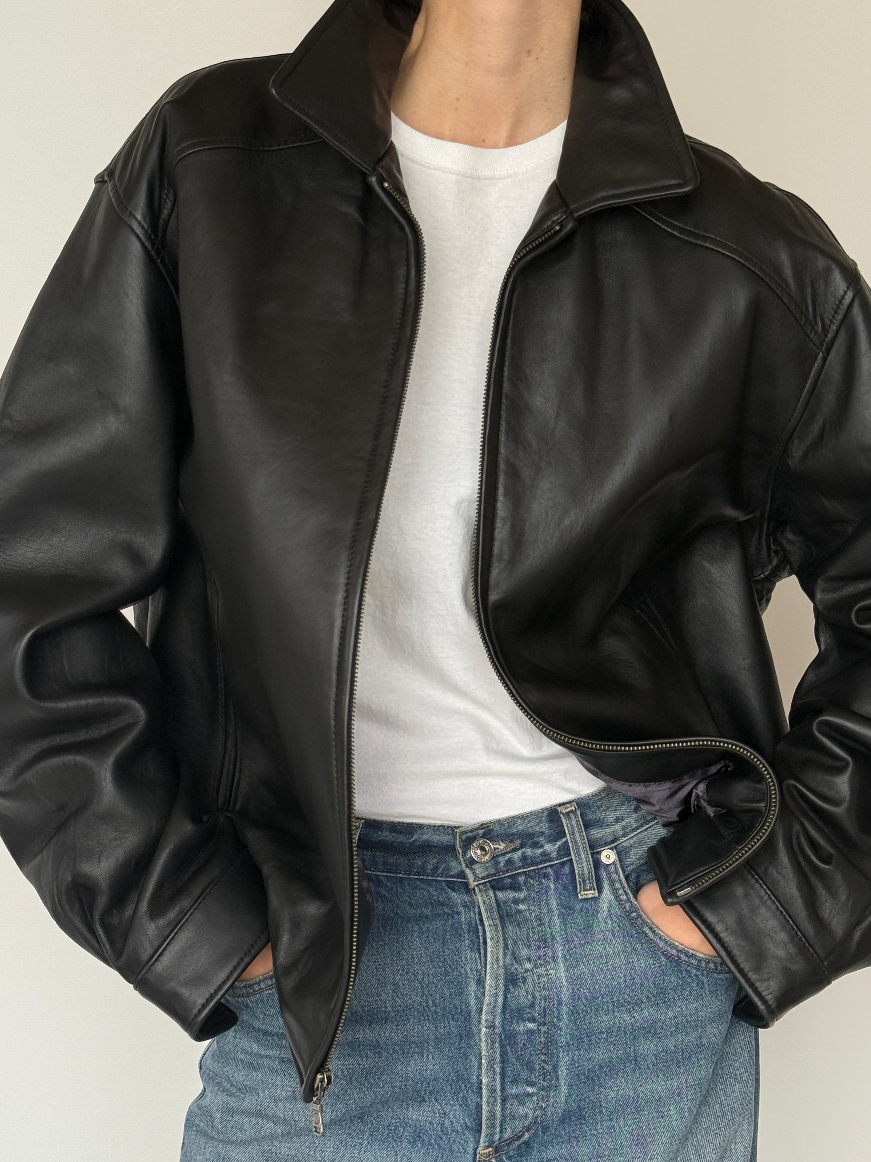 Vintage black leather jacket leather texture close-up