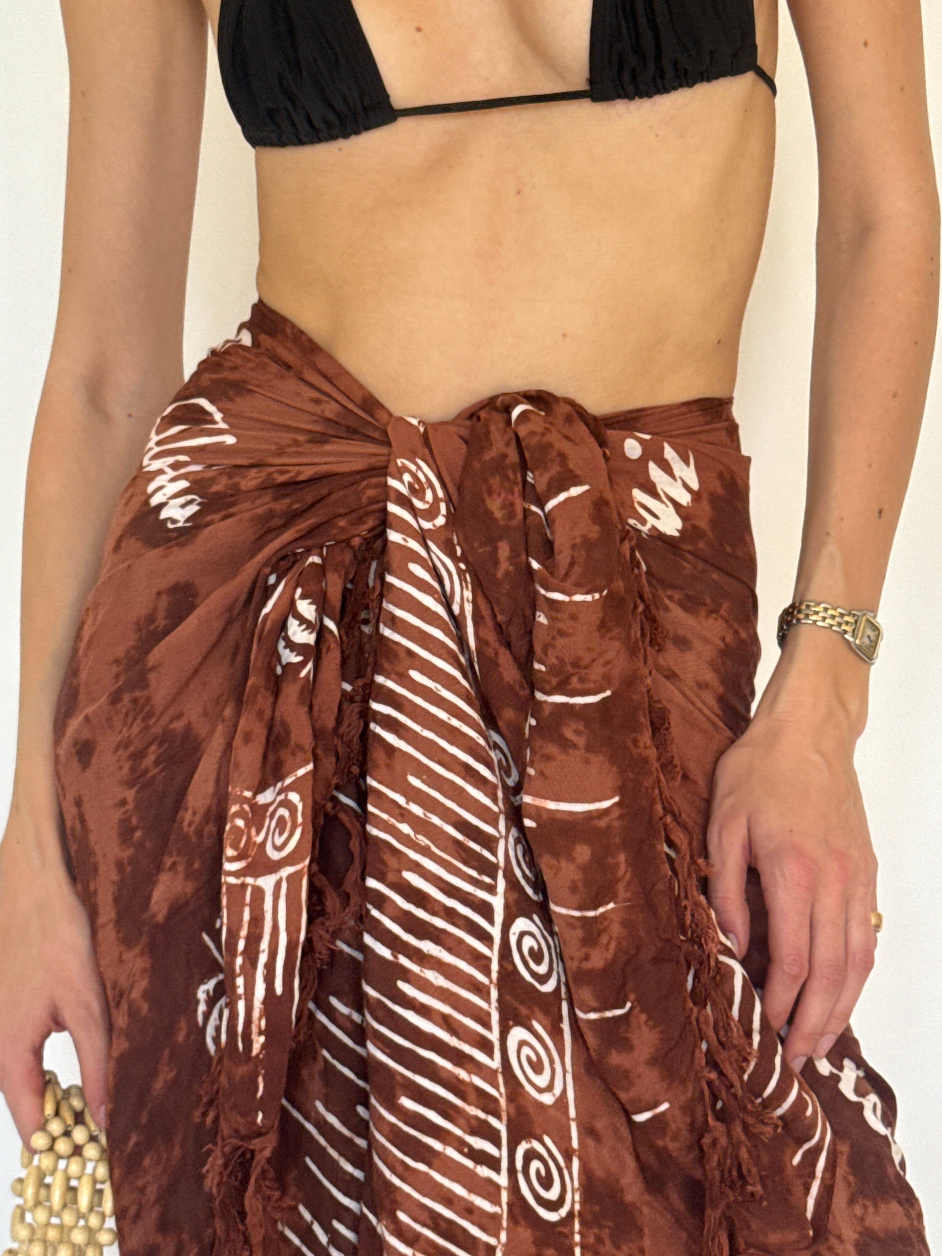 Vintage brown tropical sarong fabric close-up