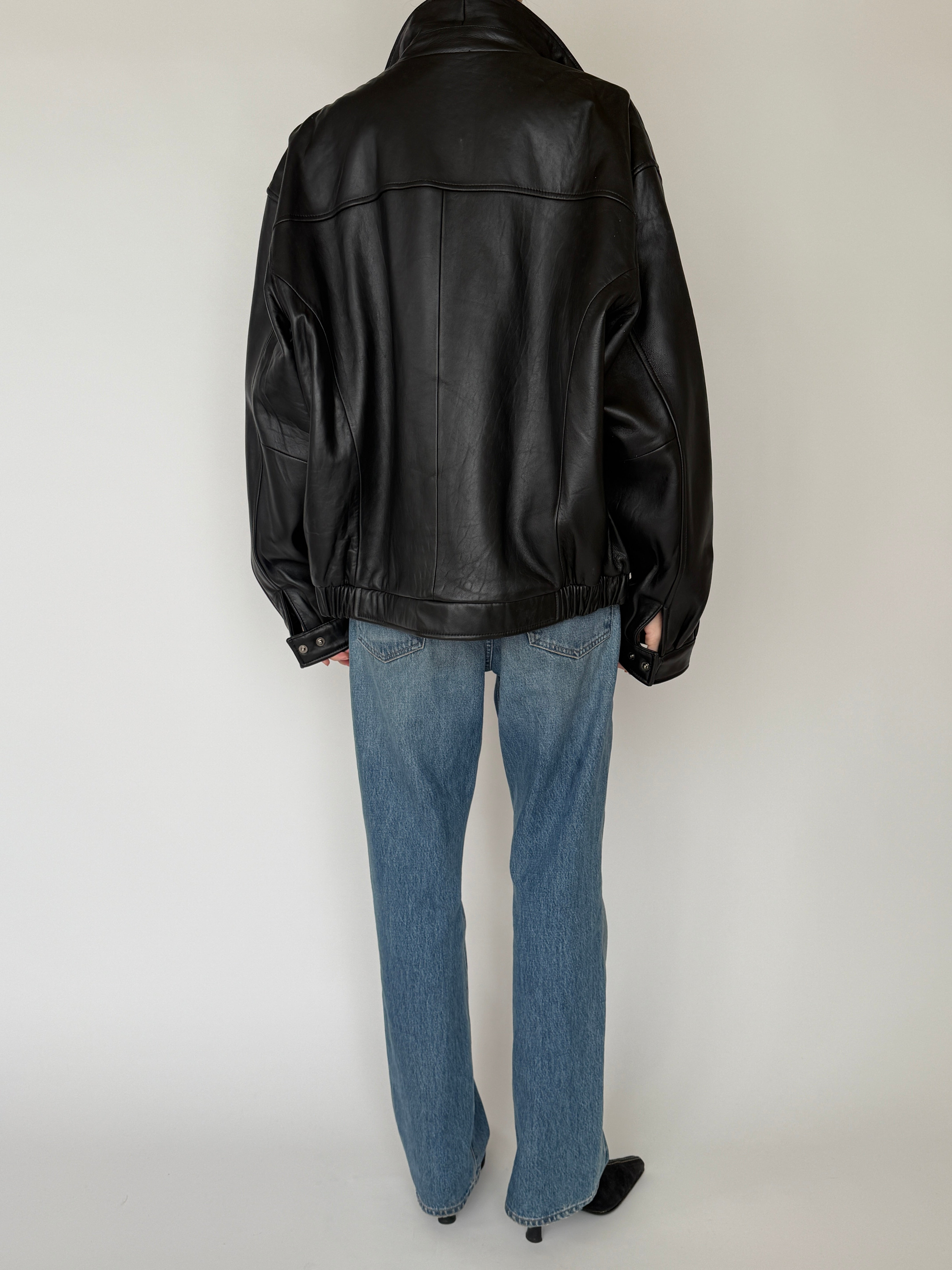 Vintage black leather jacket back view