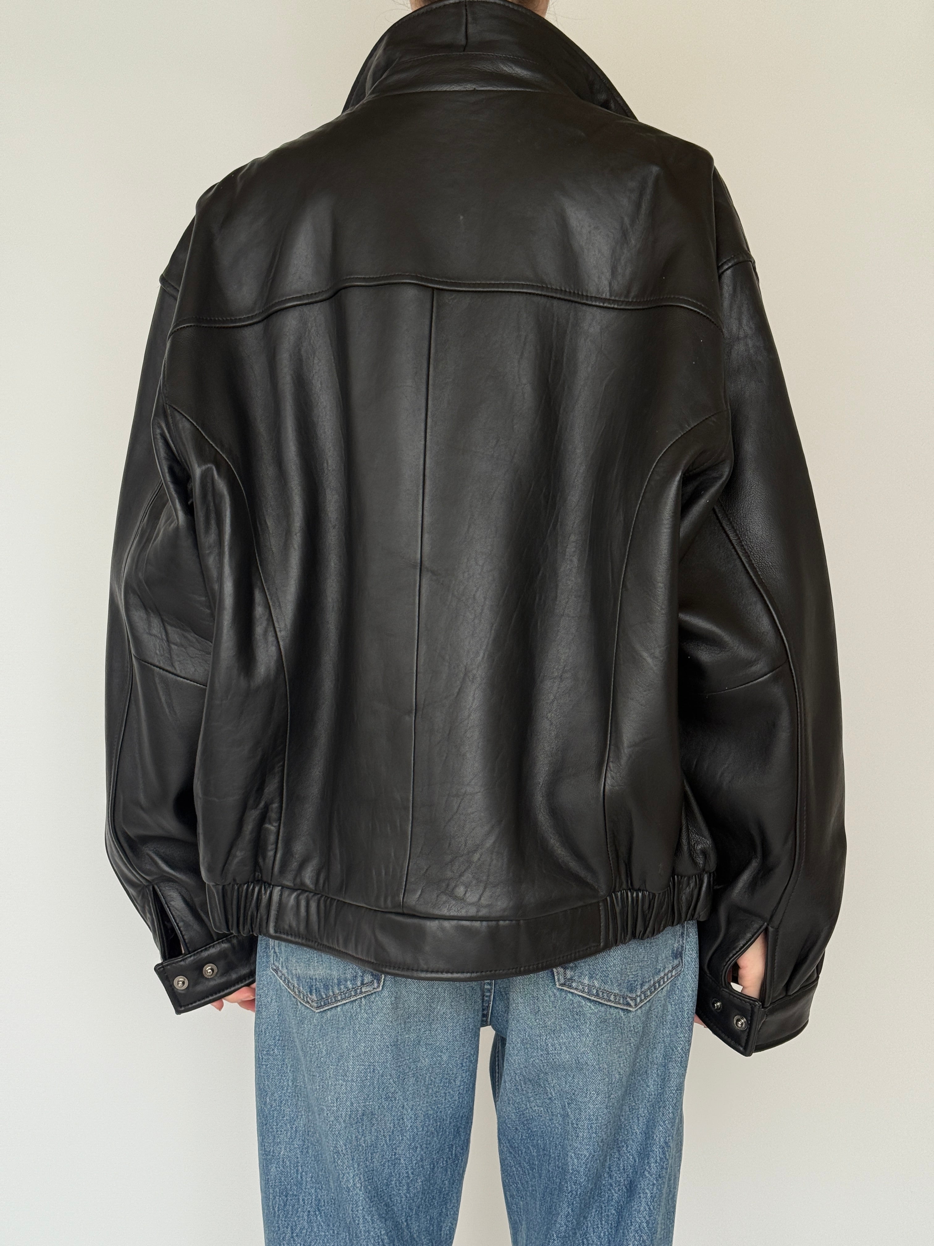 Vintage black leather jacket back view