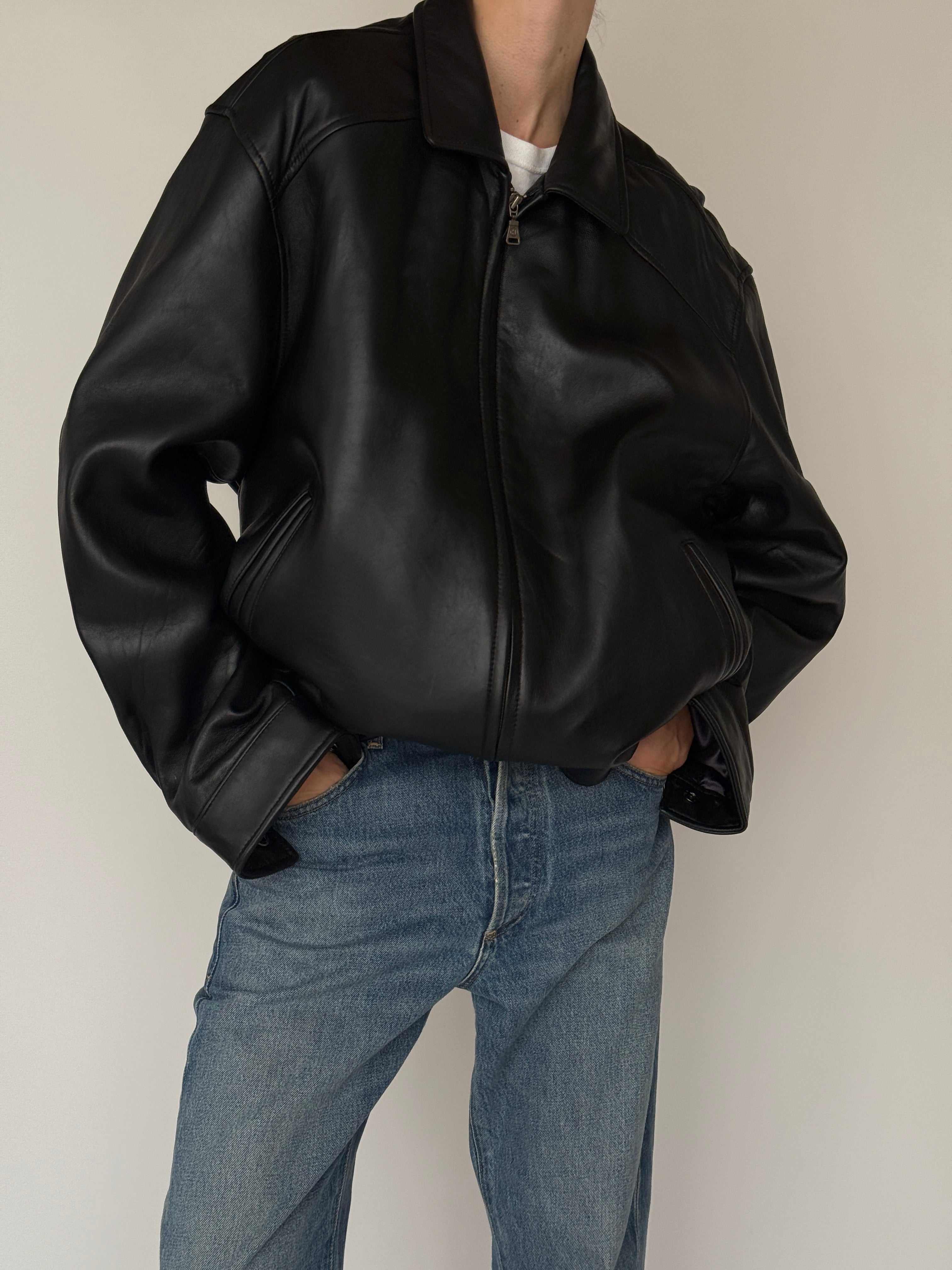 Vintage black leather jacket leather texture close-up