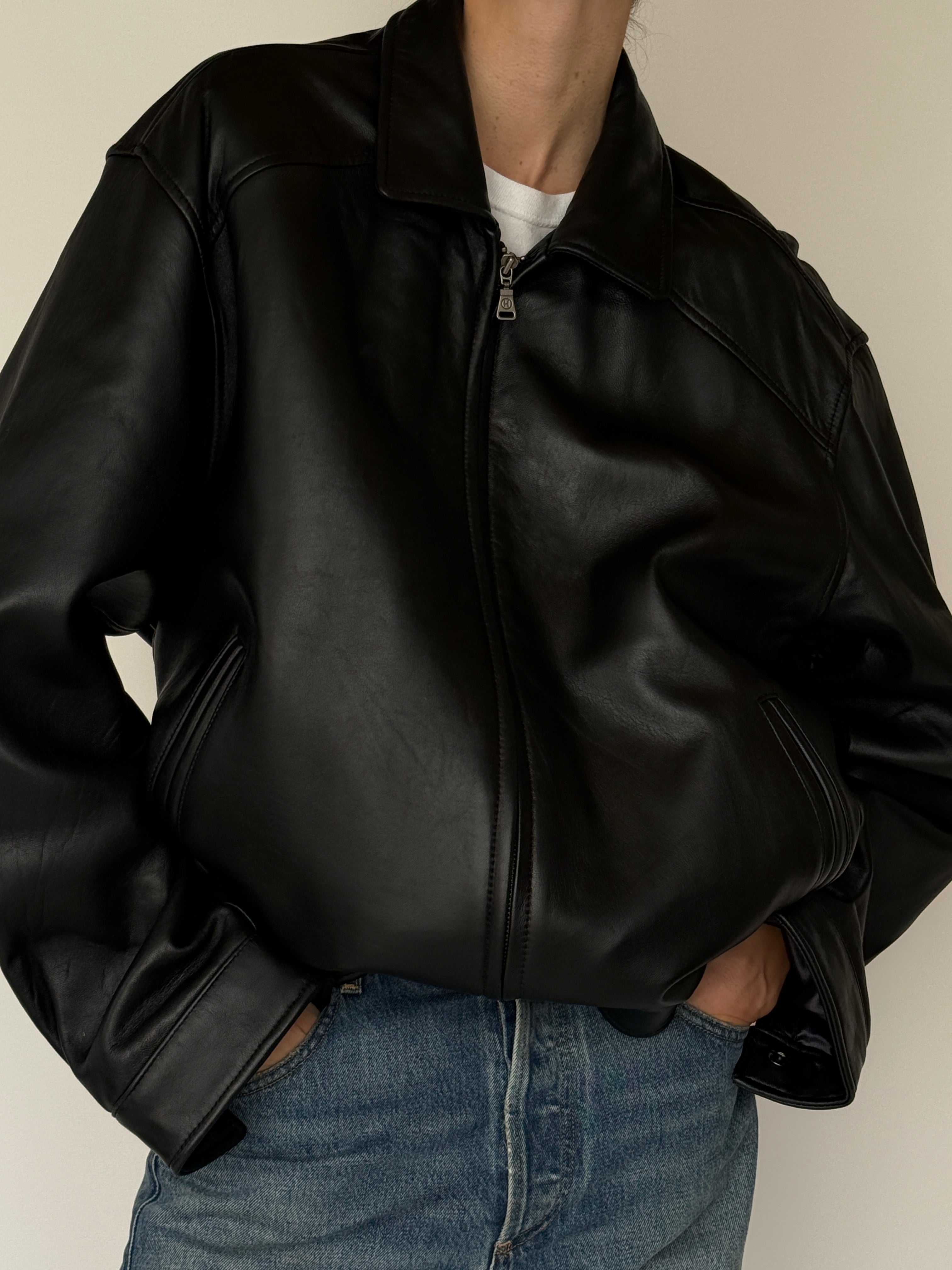 Vintage black leather jacket zipper detail