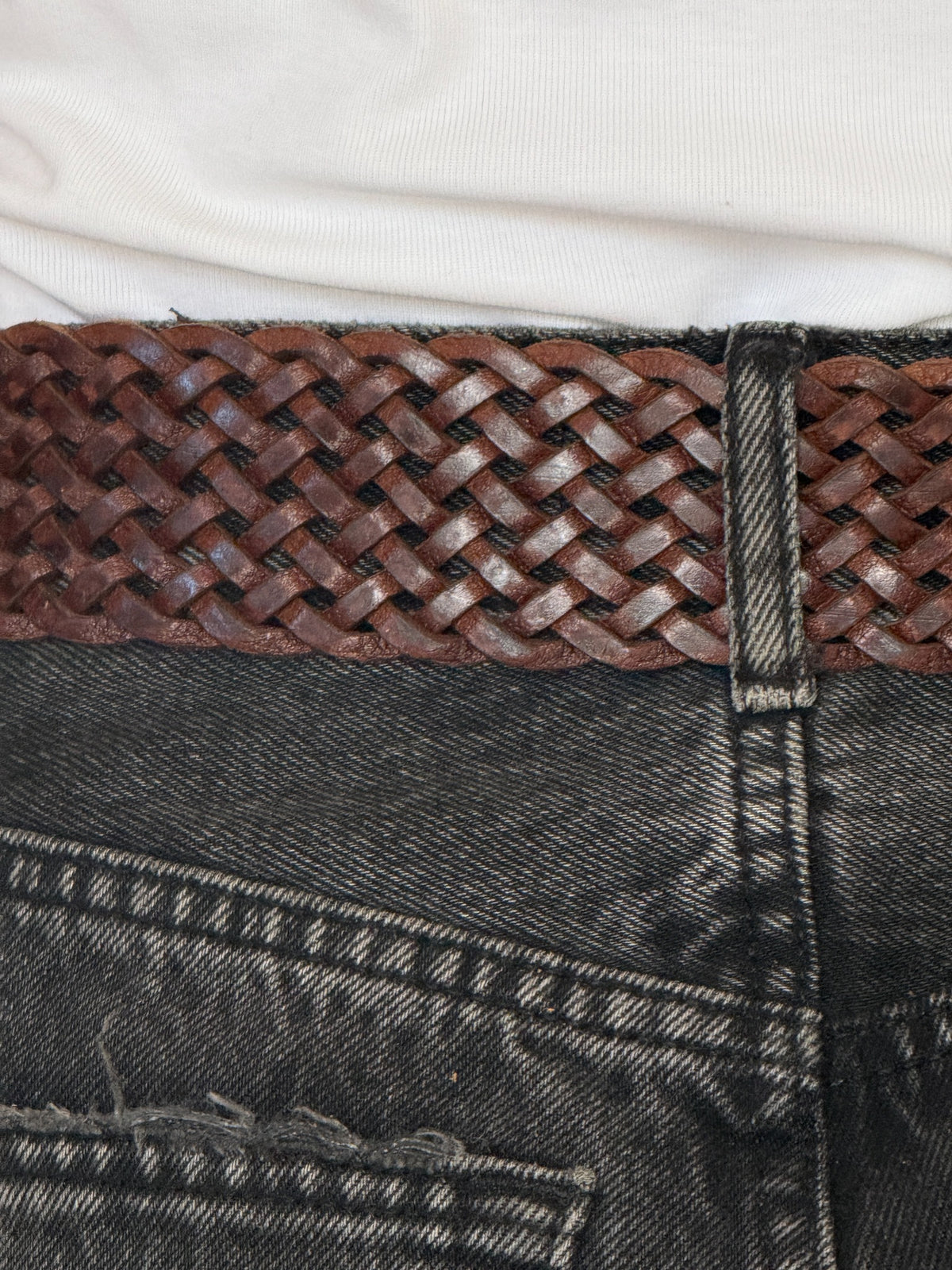 Vintage brown braided leather belt weave detail