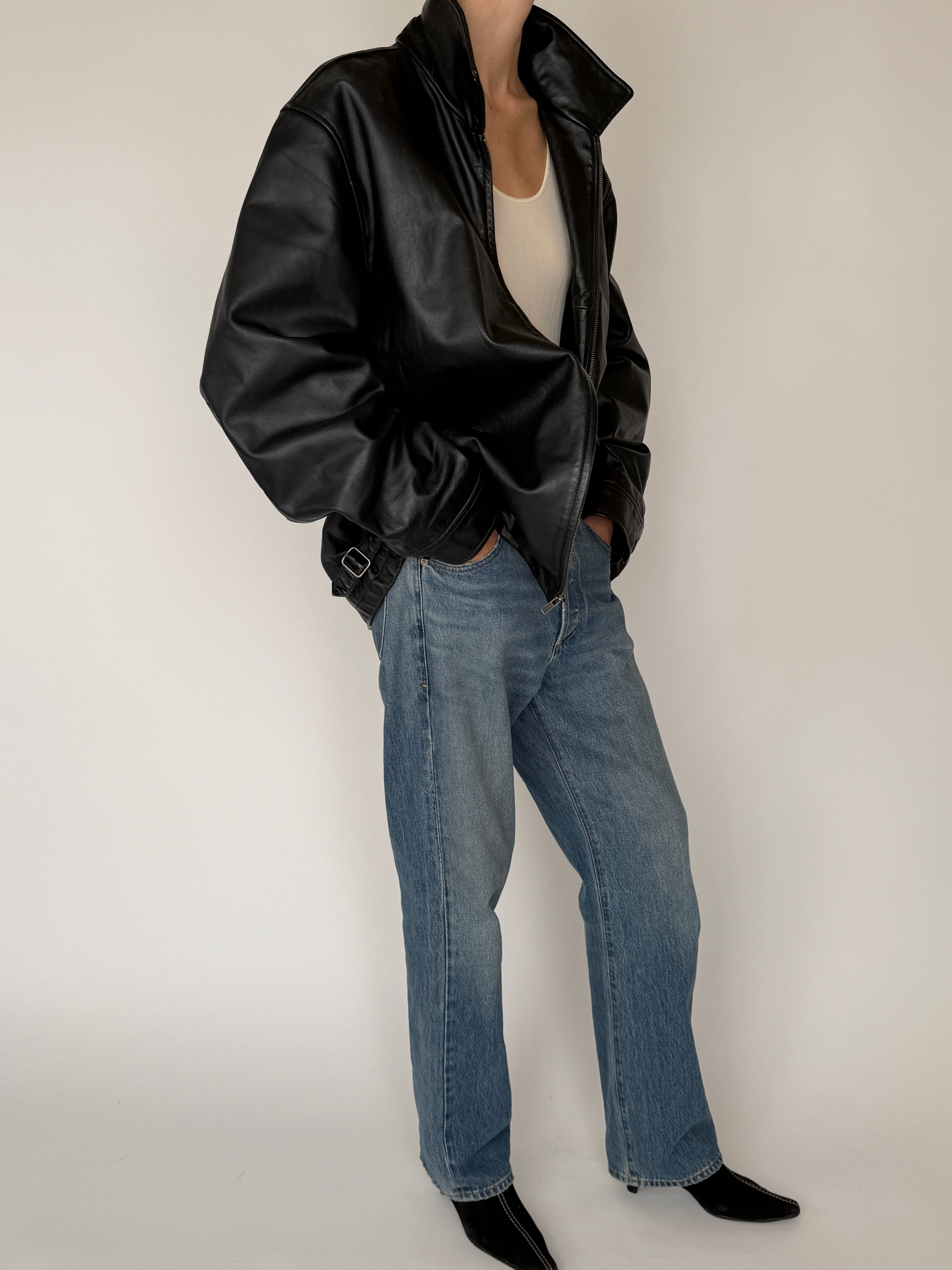Vintage leather jacket featuring oversized fit and smooth leather finish in black styled
