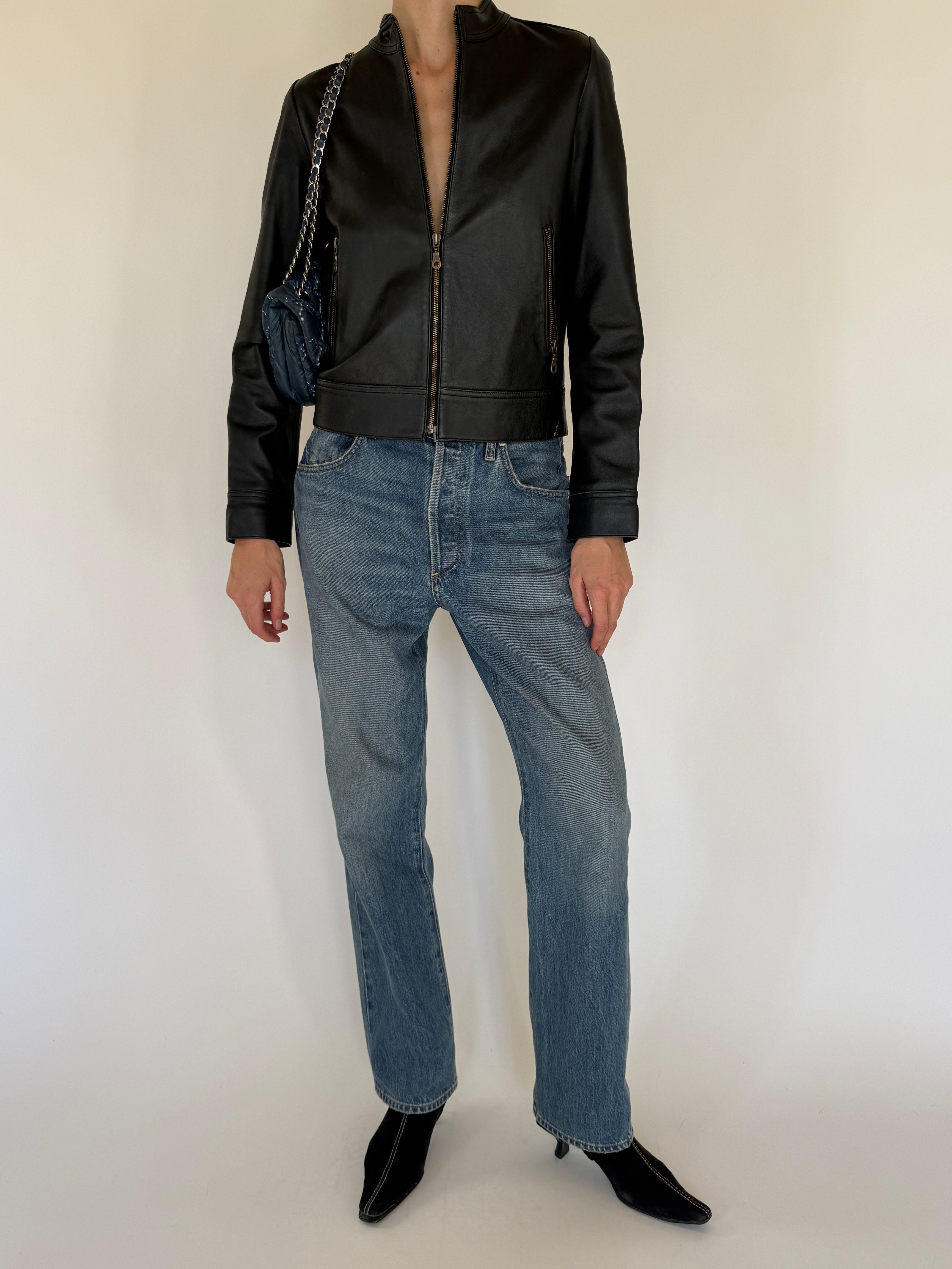 Vintage black leather jacket full length view