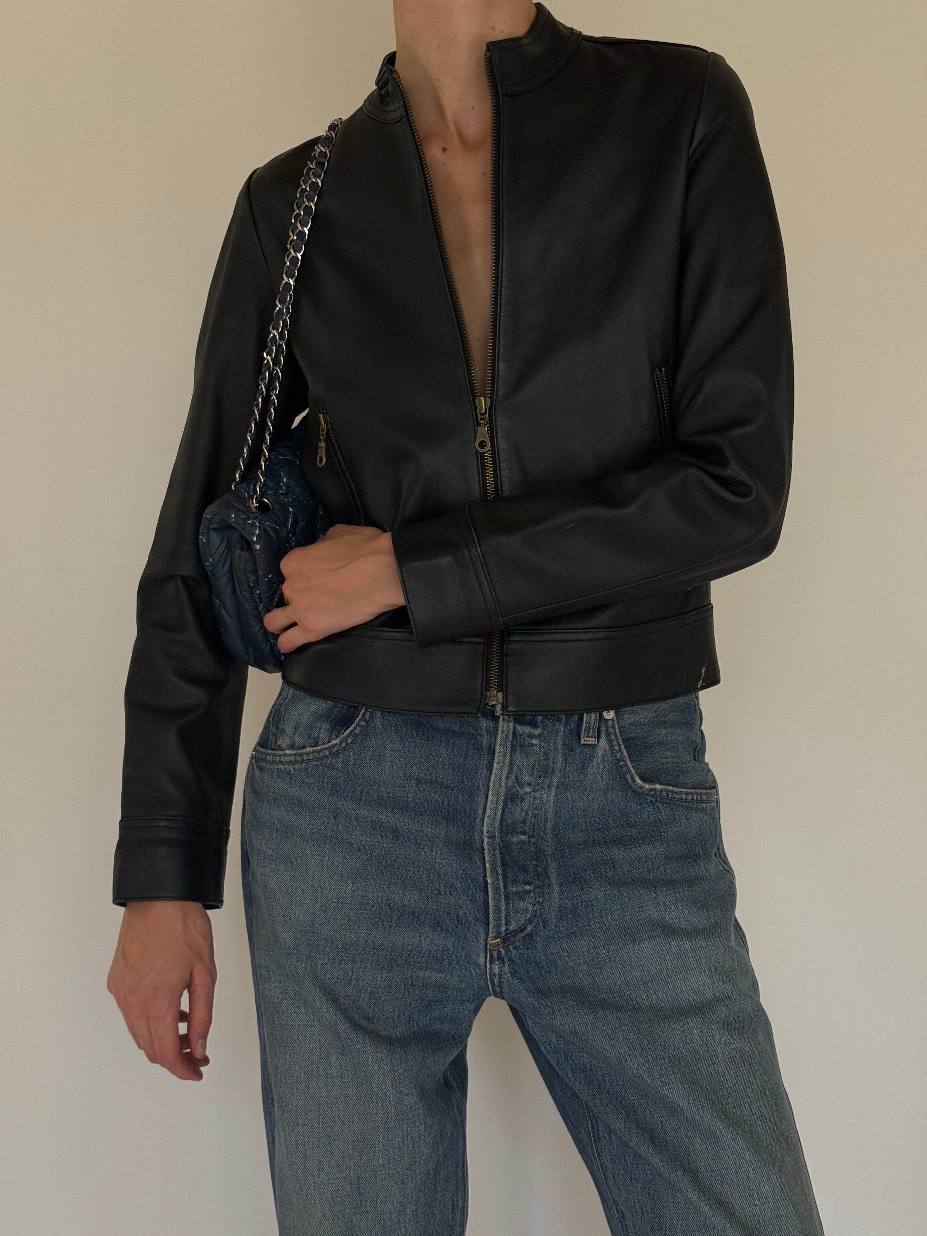 Vintage black leather jacket stand collar detail