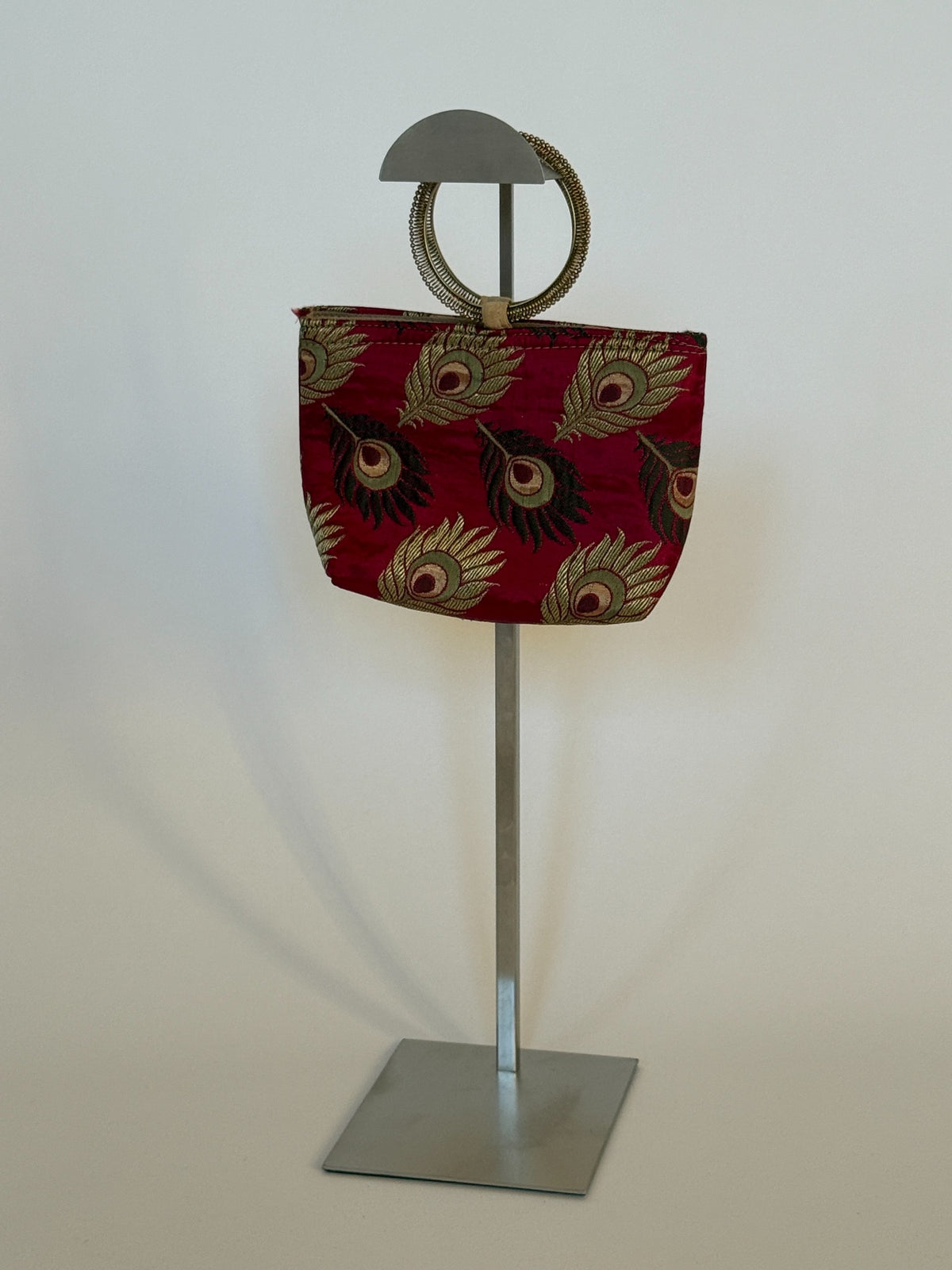 Full vintage ring handle mini bag on display stand