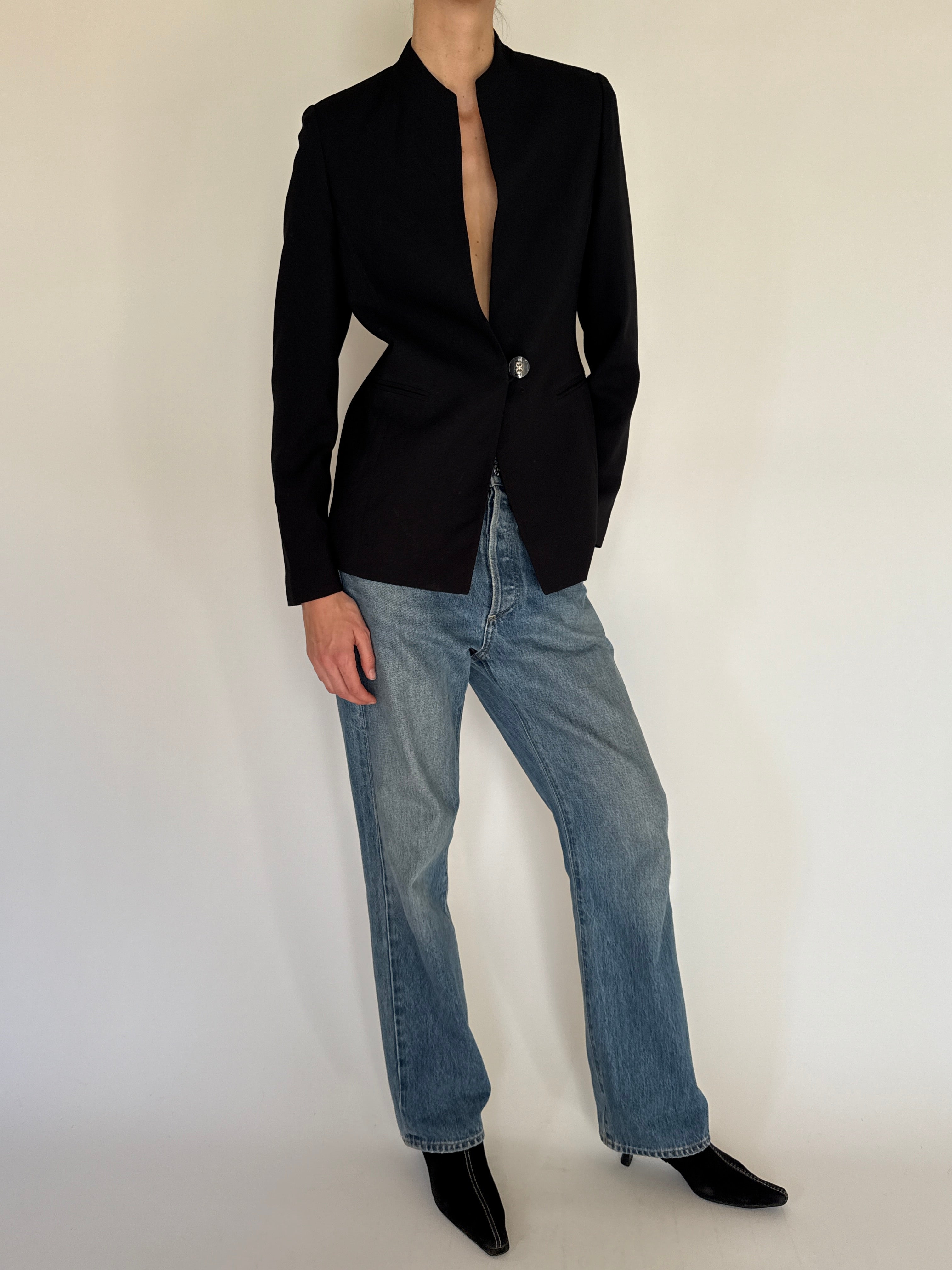 Vintage black blazer fabric close-up smooth texture