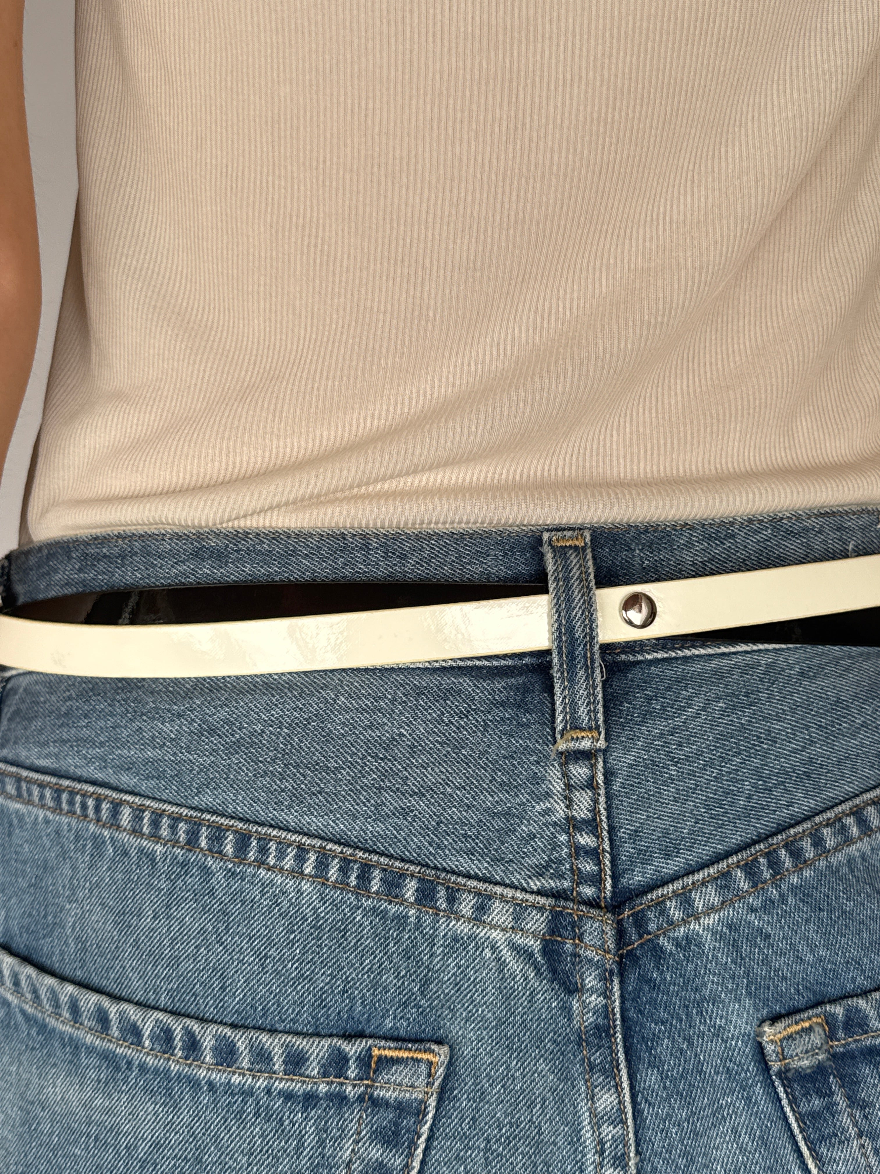 Vintage two-tone leather belt with high-shine finish in black ivory back view