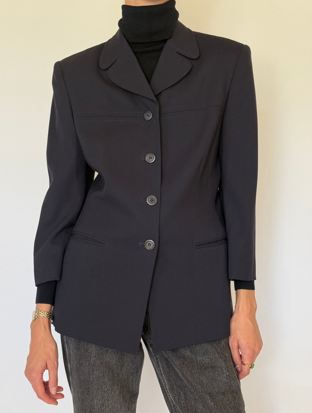Close-up of navy blazer four-button front