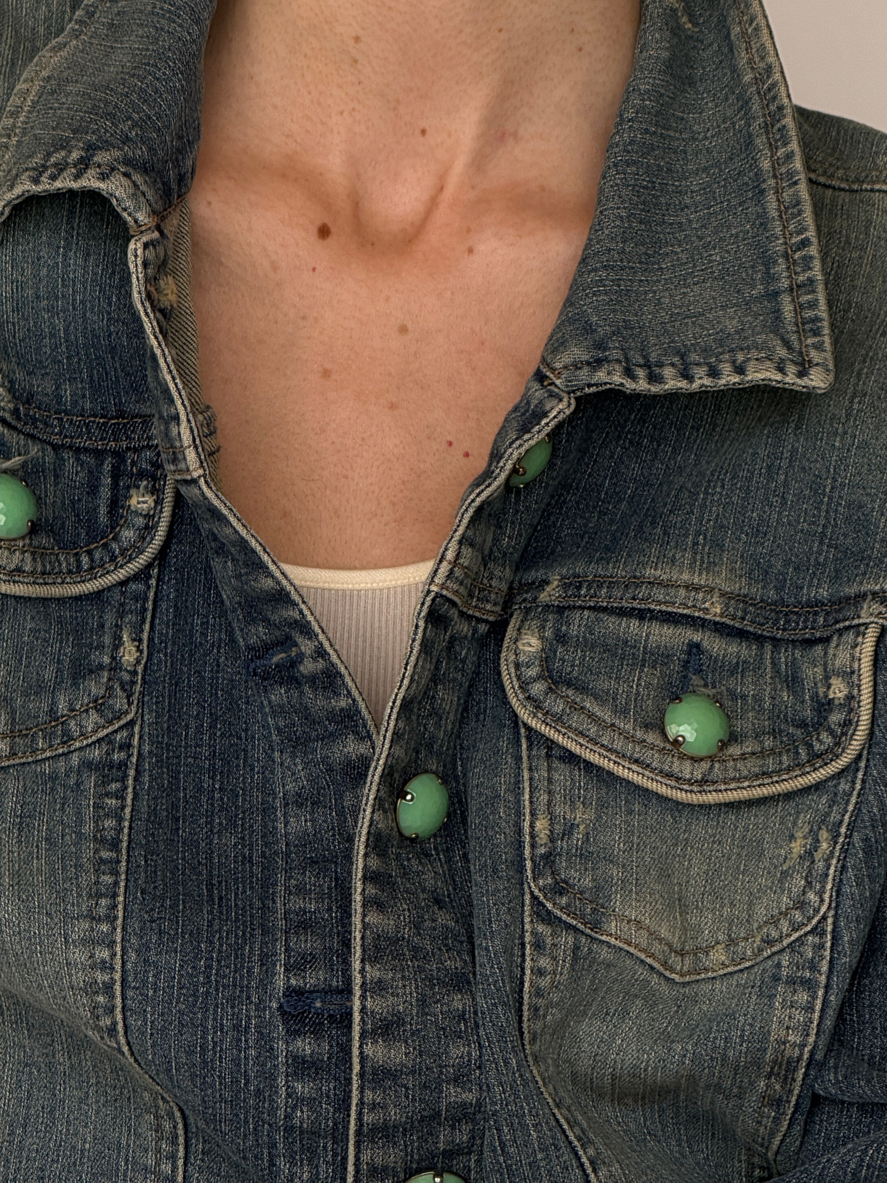 Vintage blue denim jacket button and pocket detail