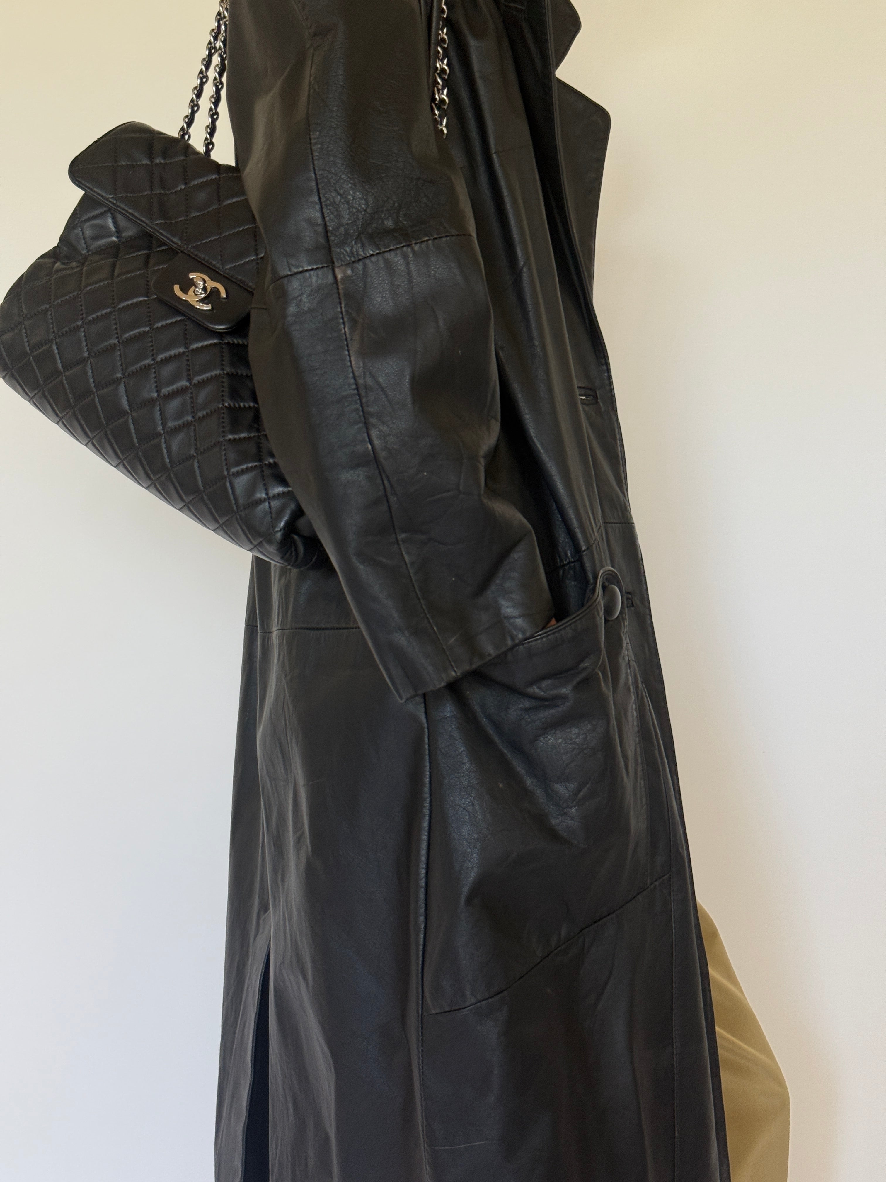 Vintage black leather trench coat leather close-up