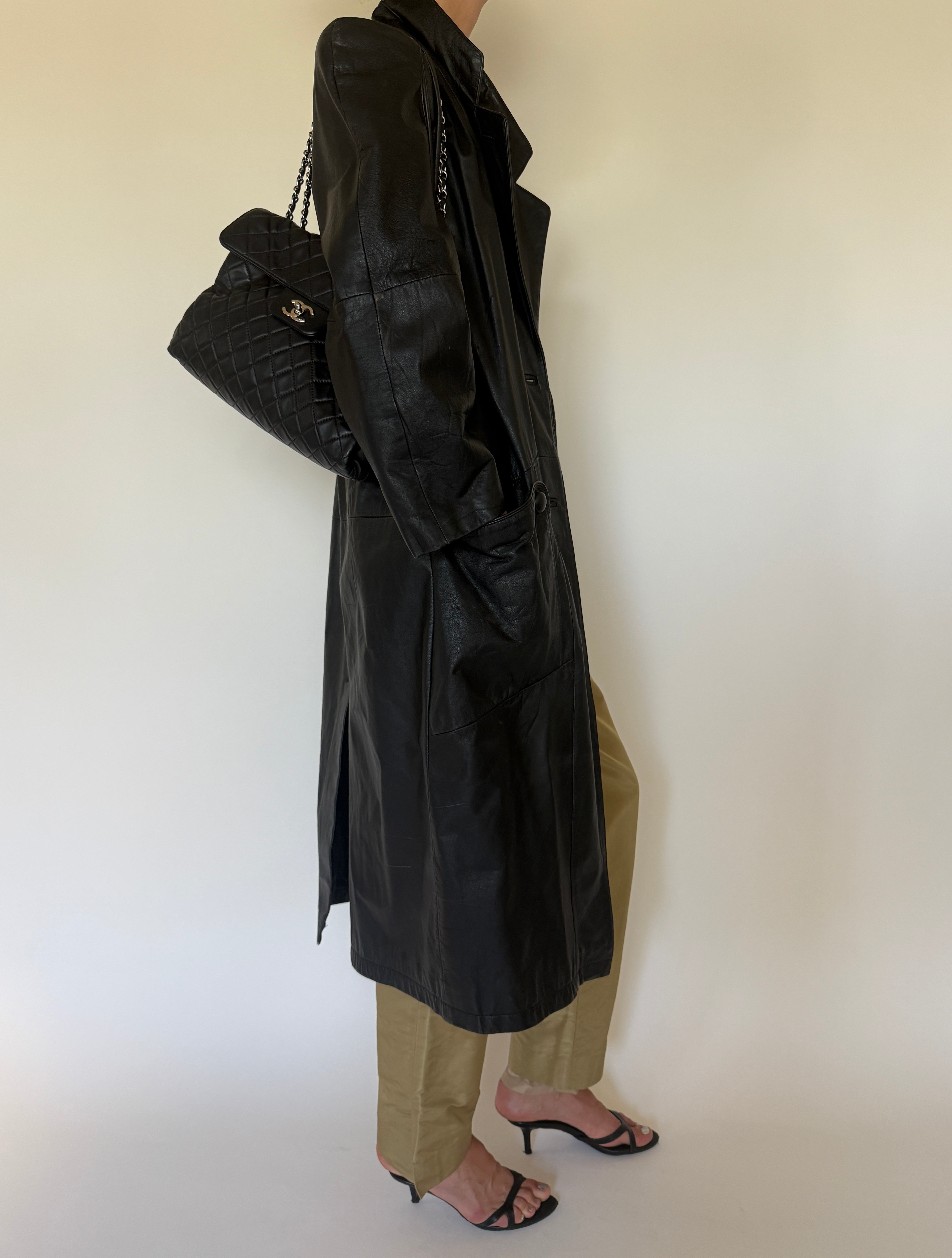 Vintage black leather trench coat side view