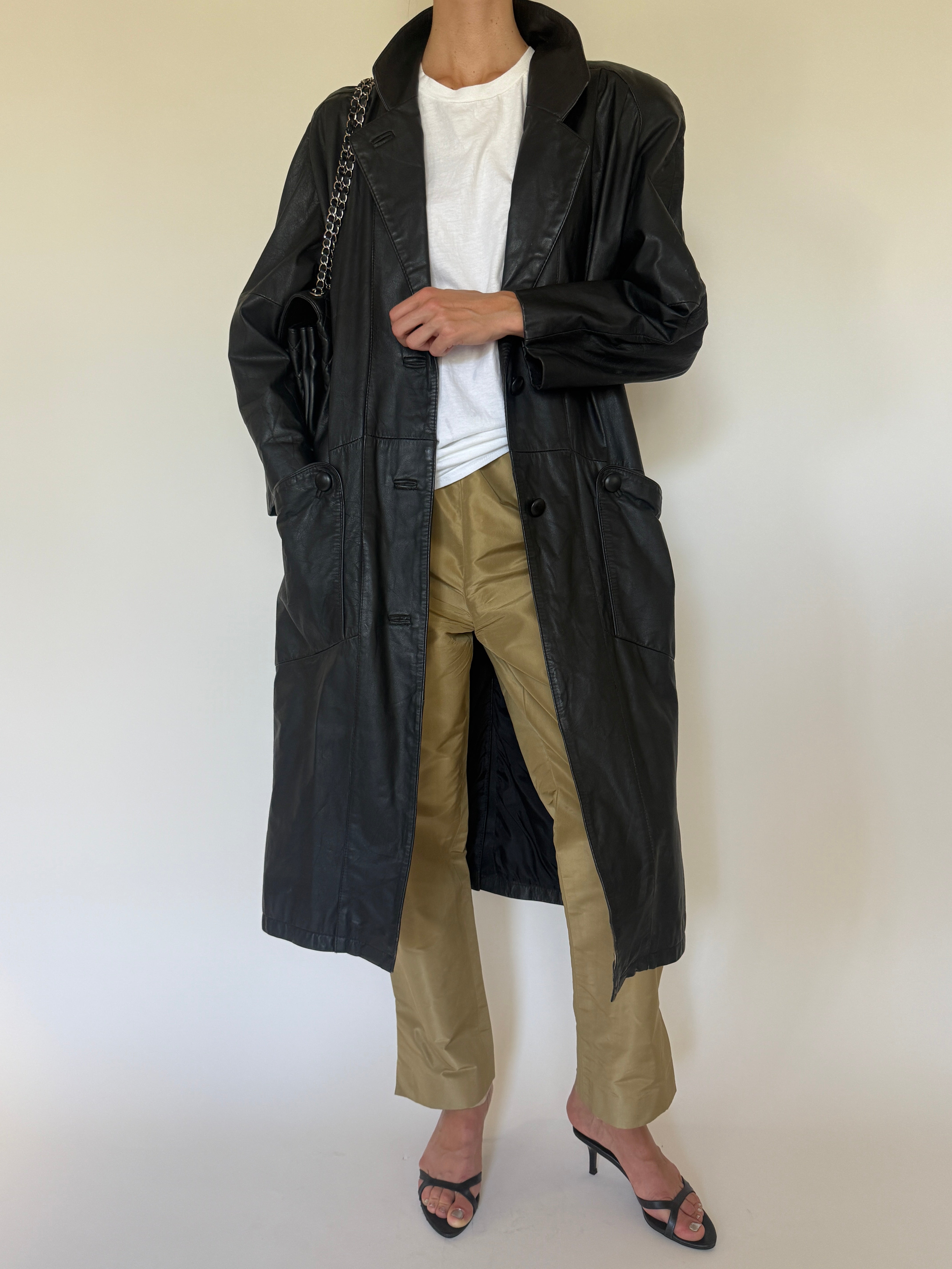 Vintage black leather trench coat front view