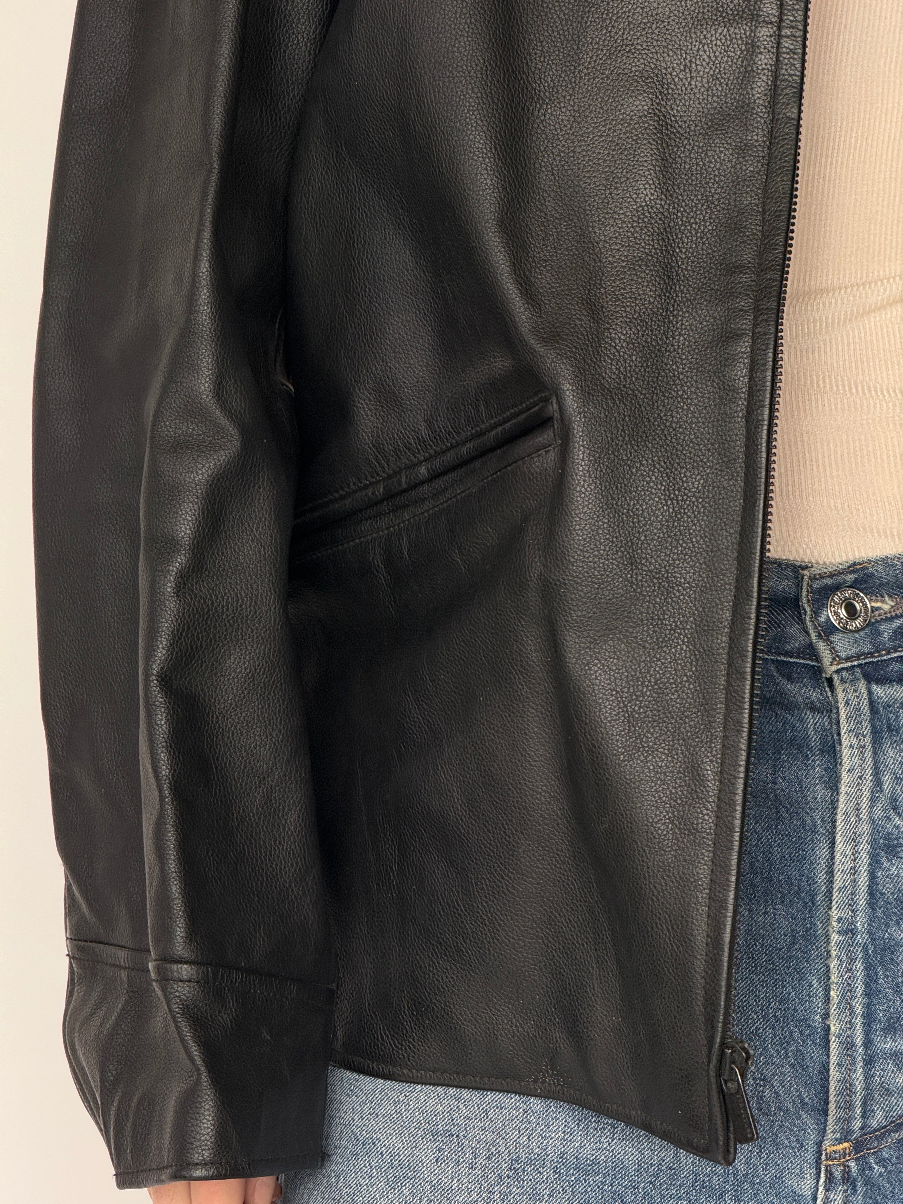 Vintage black leather jacket leather texture detail