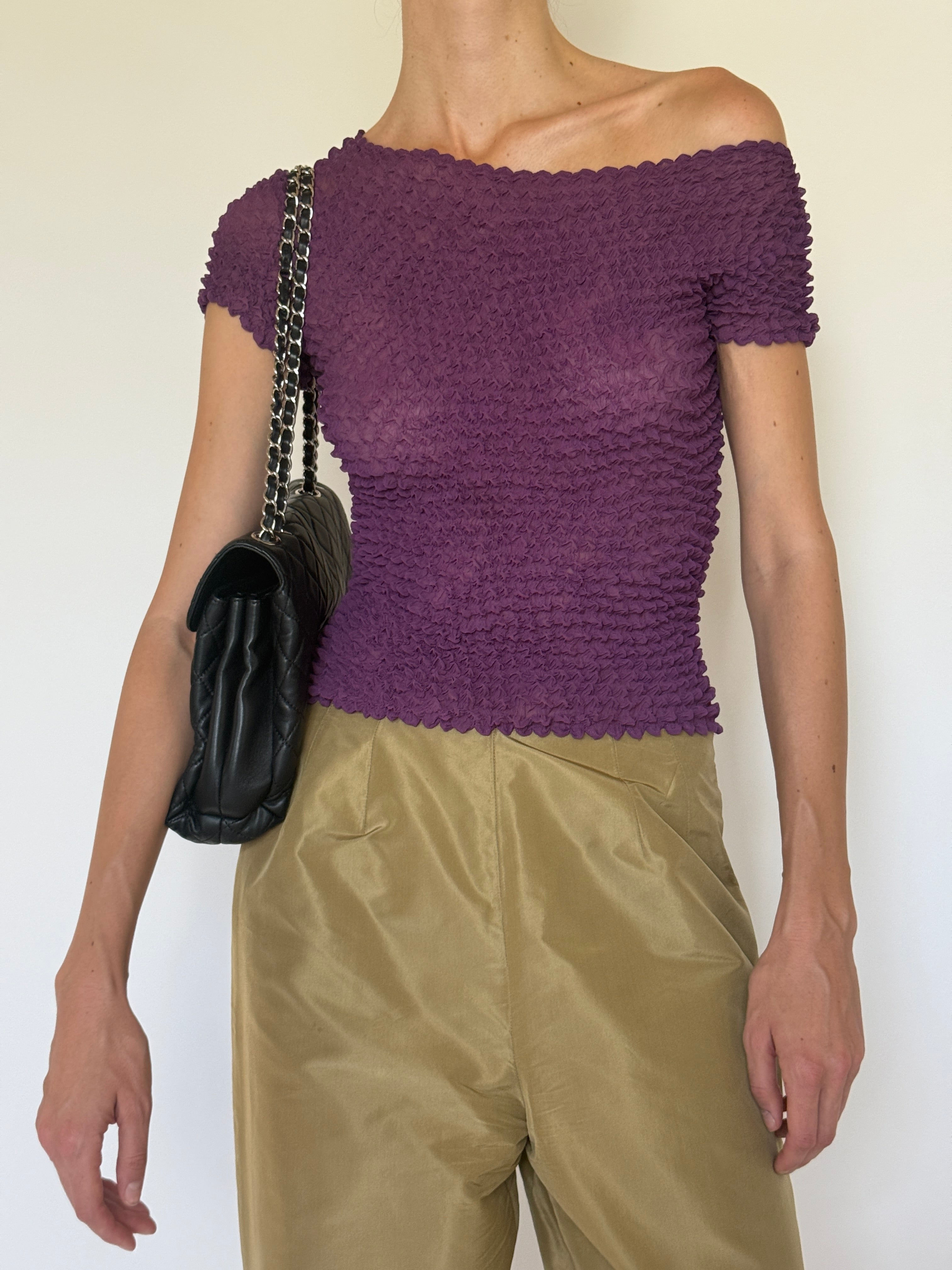 Vintage purple top textured fabric close-up