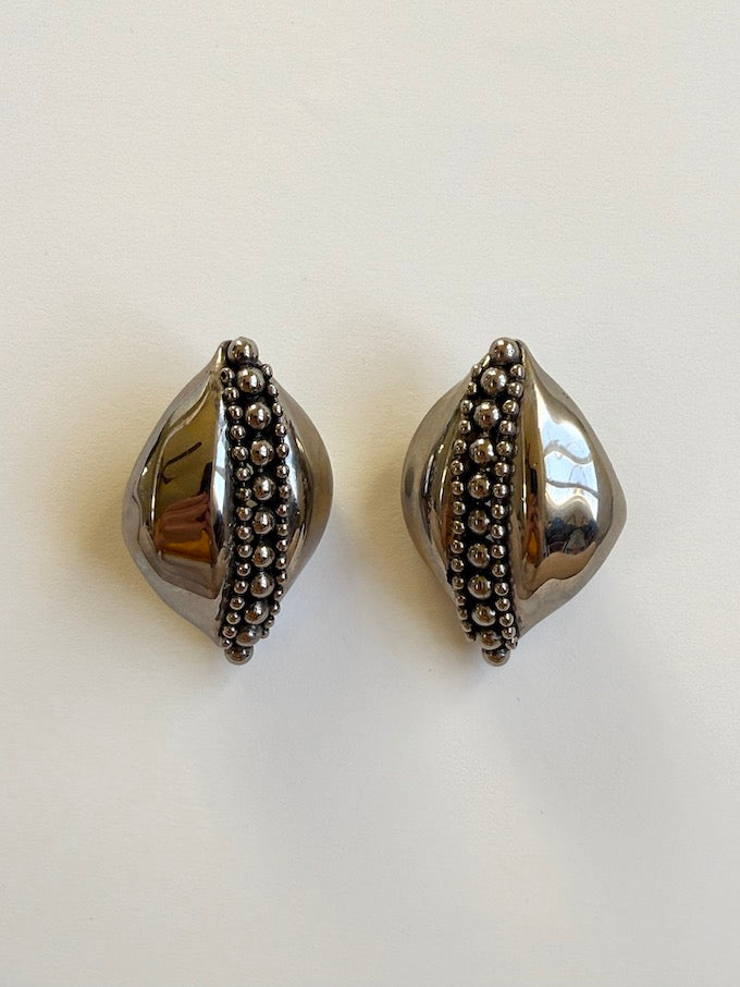 Sculptural leaf-like silver-tone vintage earring