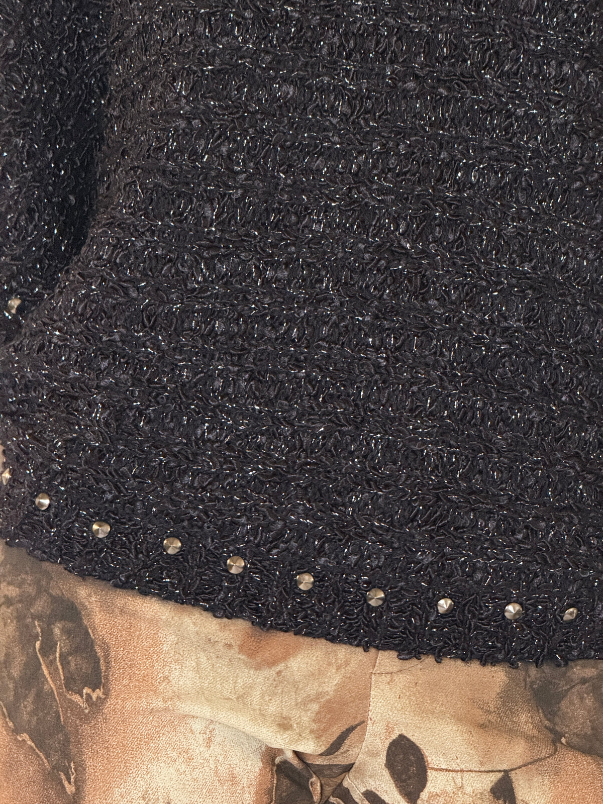 Vintage black metallic knit fabric close-up