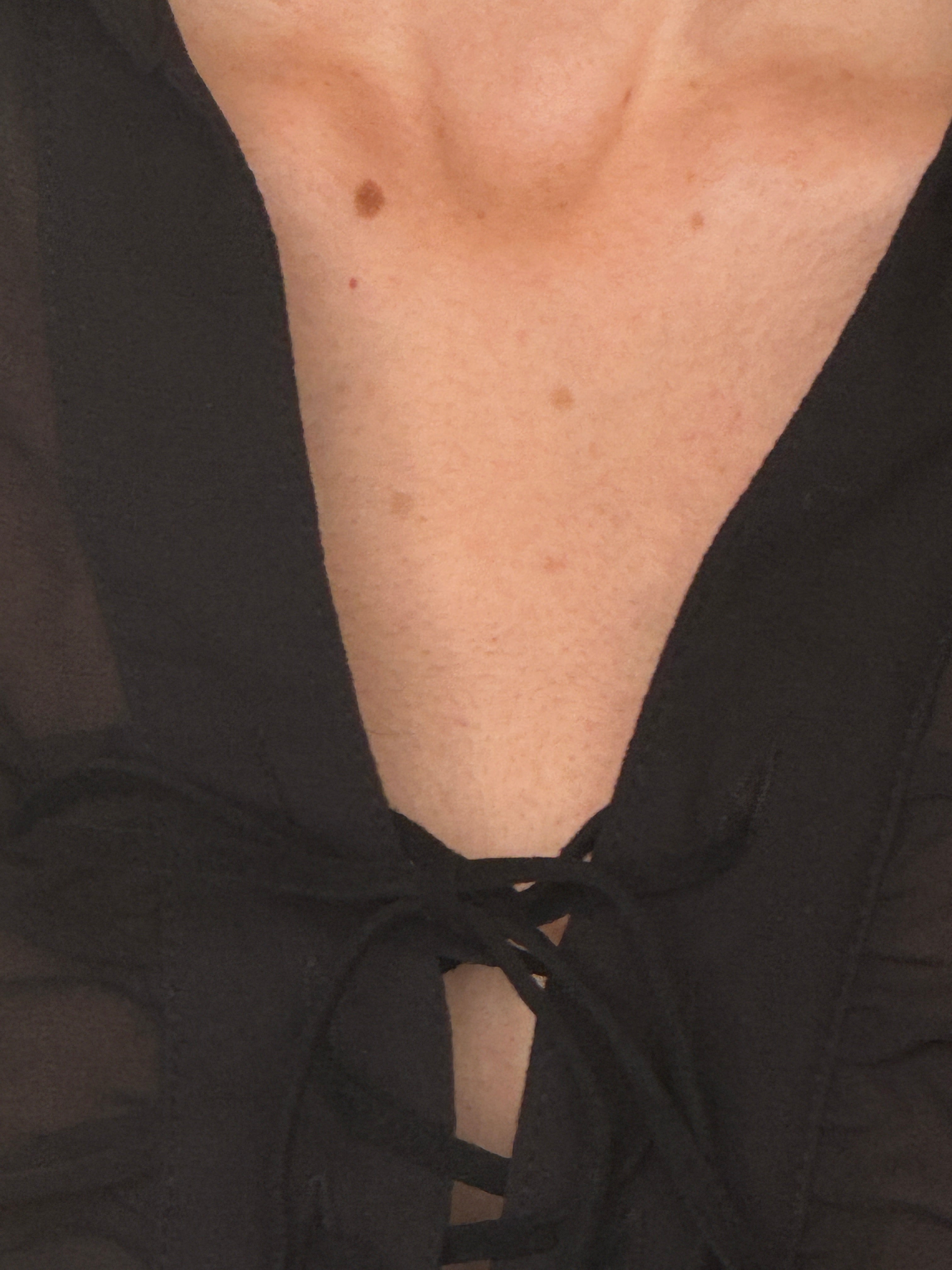 Vintage sheer blouse black lace-up neckline close up