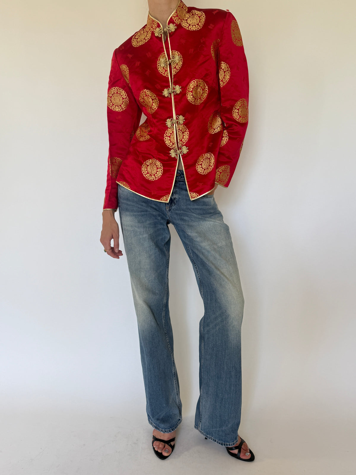 Vintage red and gold brocade fabric close-up
