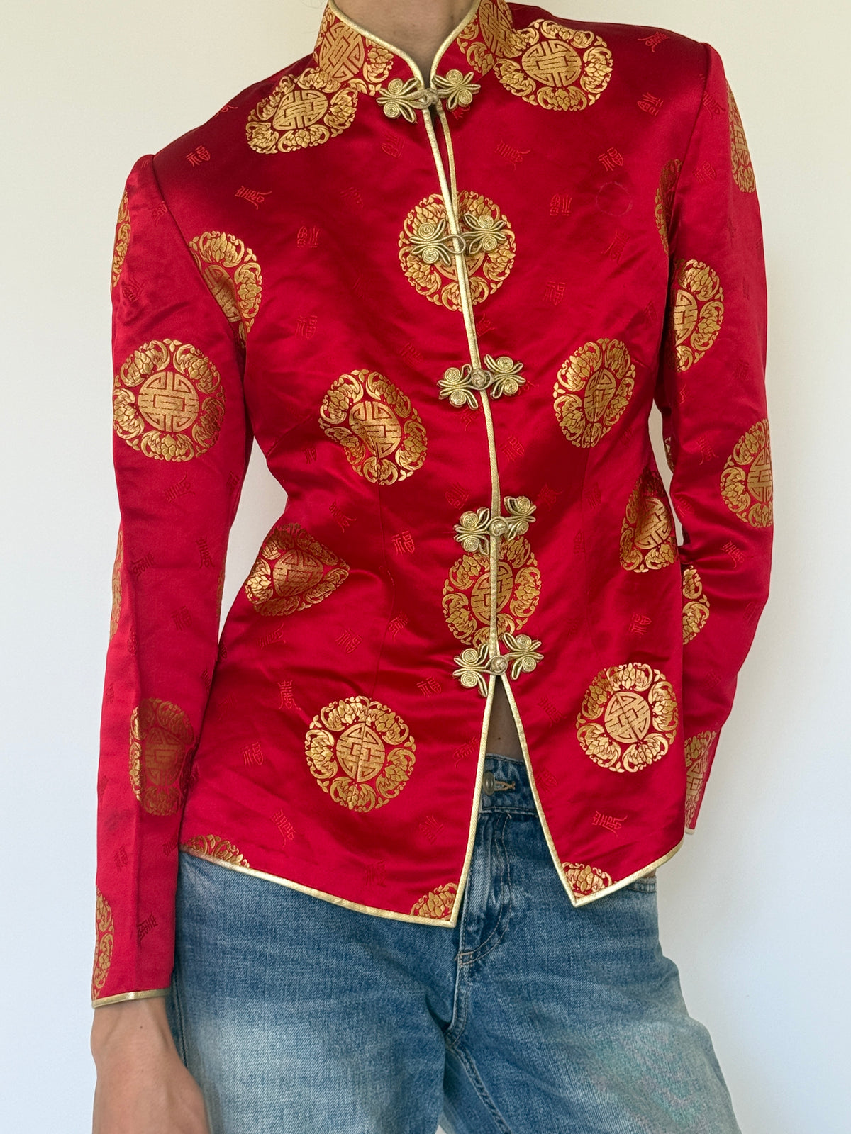 Vintage red and gold brocade fabric close-up