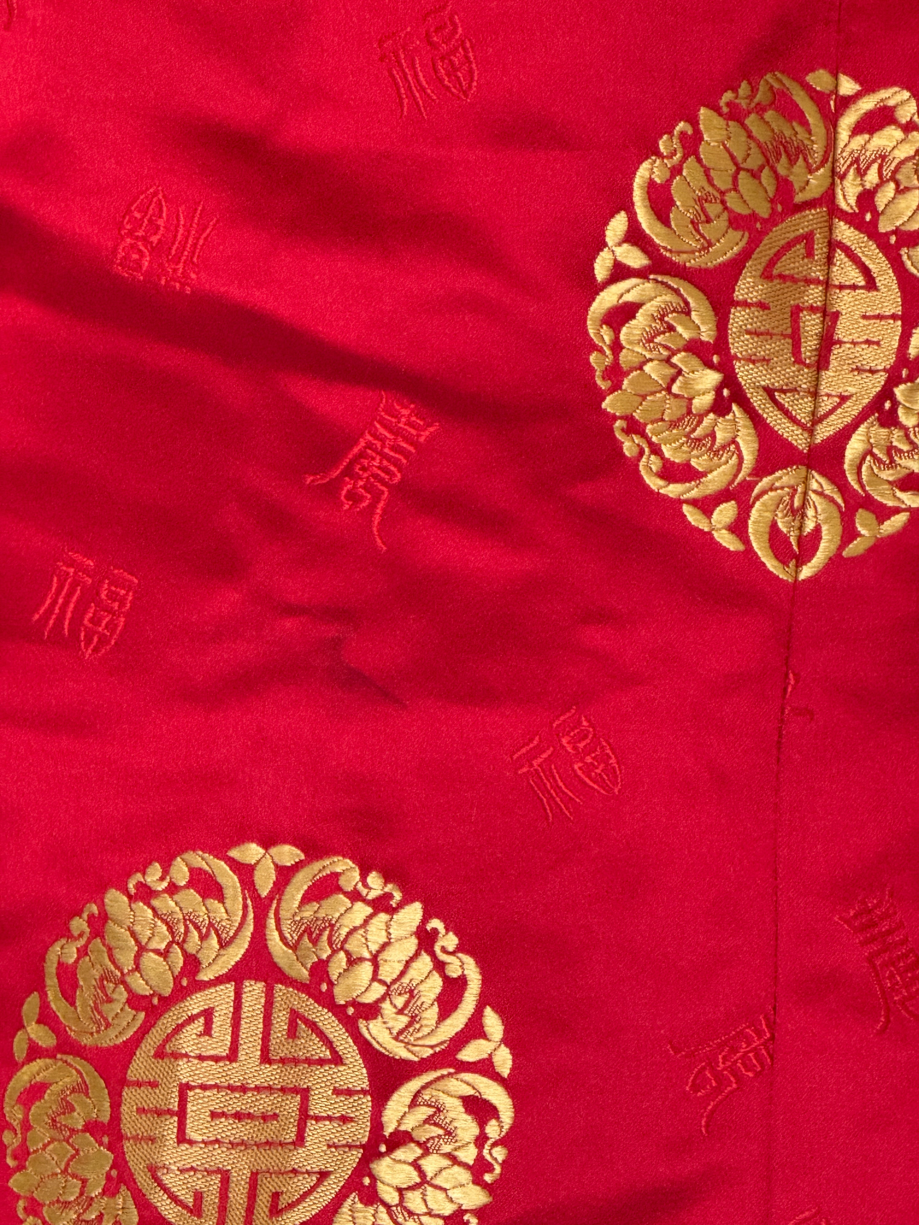 Vintage red and gold brocade fabric close-up