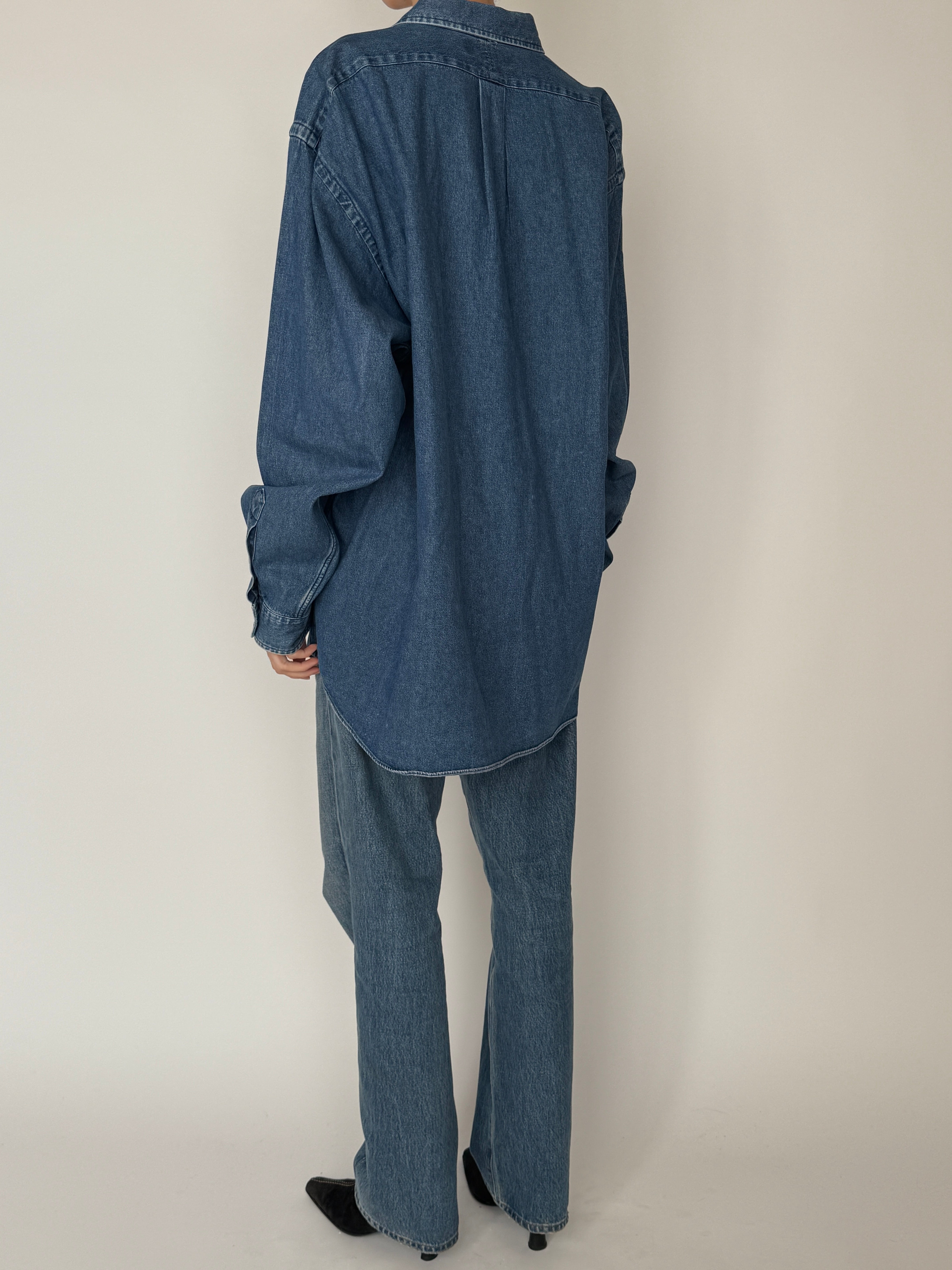 Vintage classic denim button-down with soft washed finish in blue back view