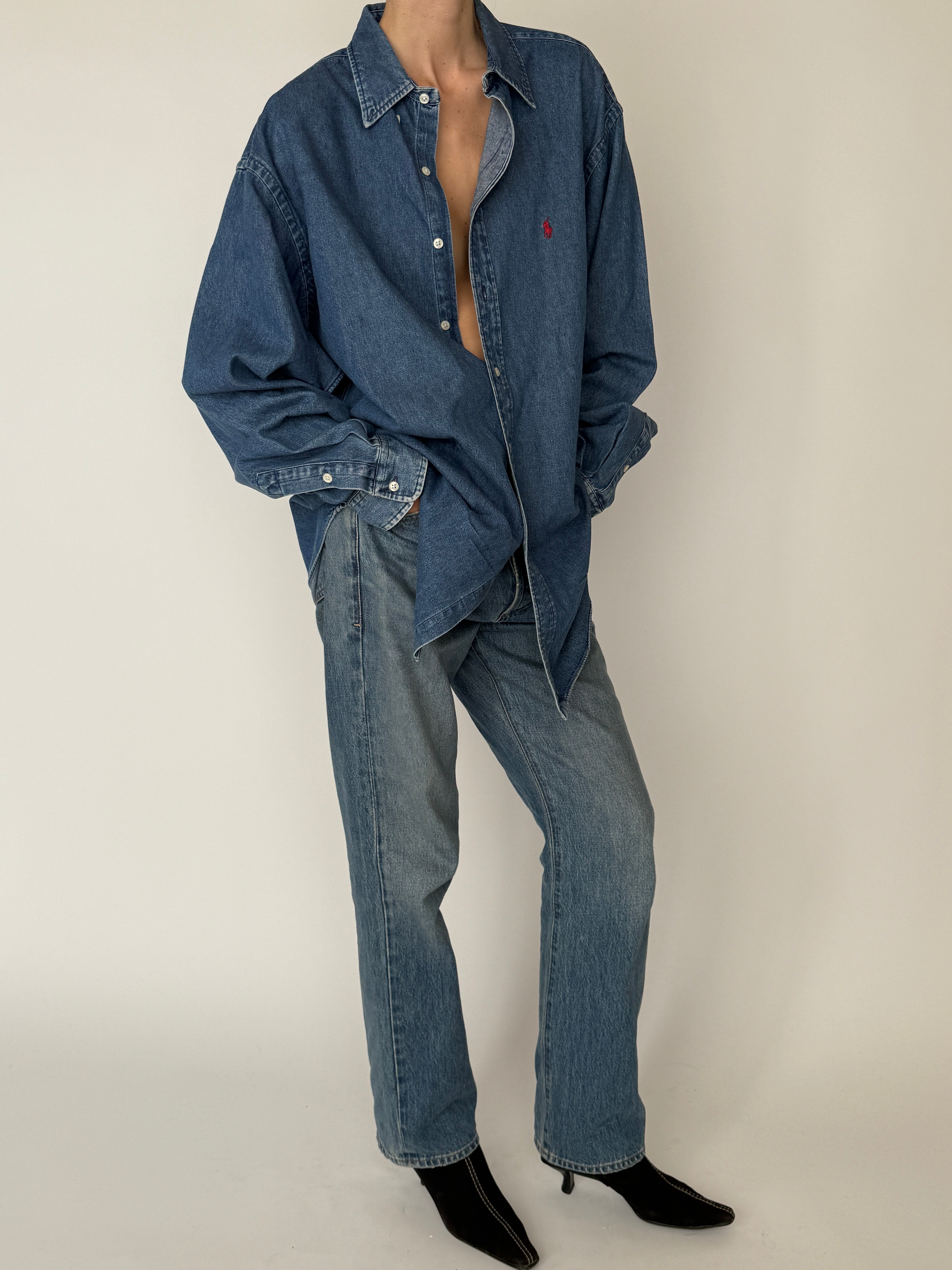 Vintage classic denim button-down with soft washed finish in blue side view styled
