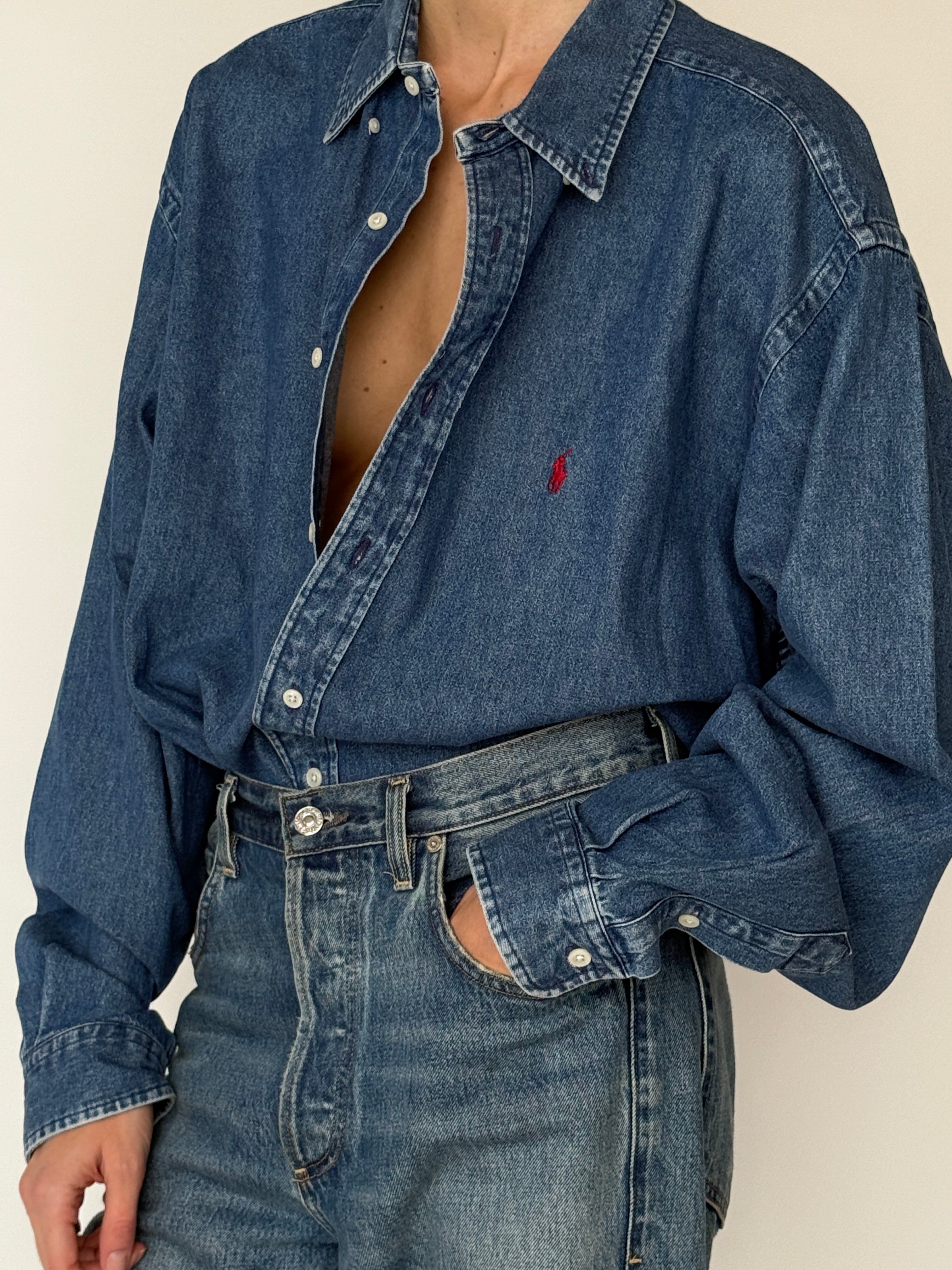 Vintage long sleeve denim shirt featuring button-front closure in blue