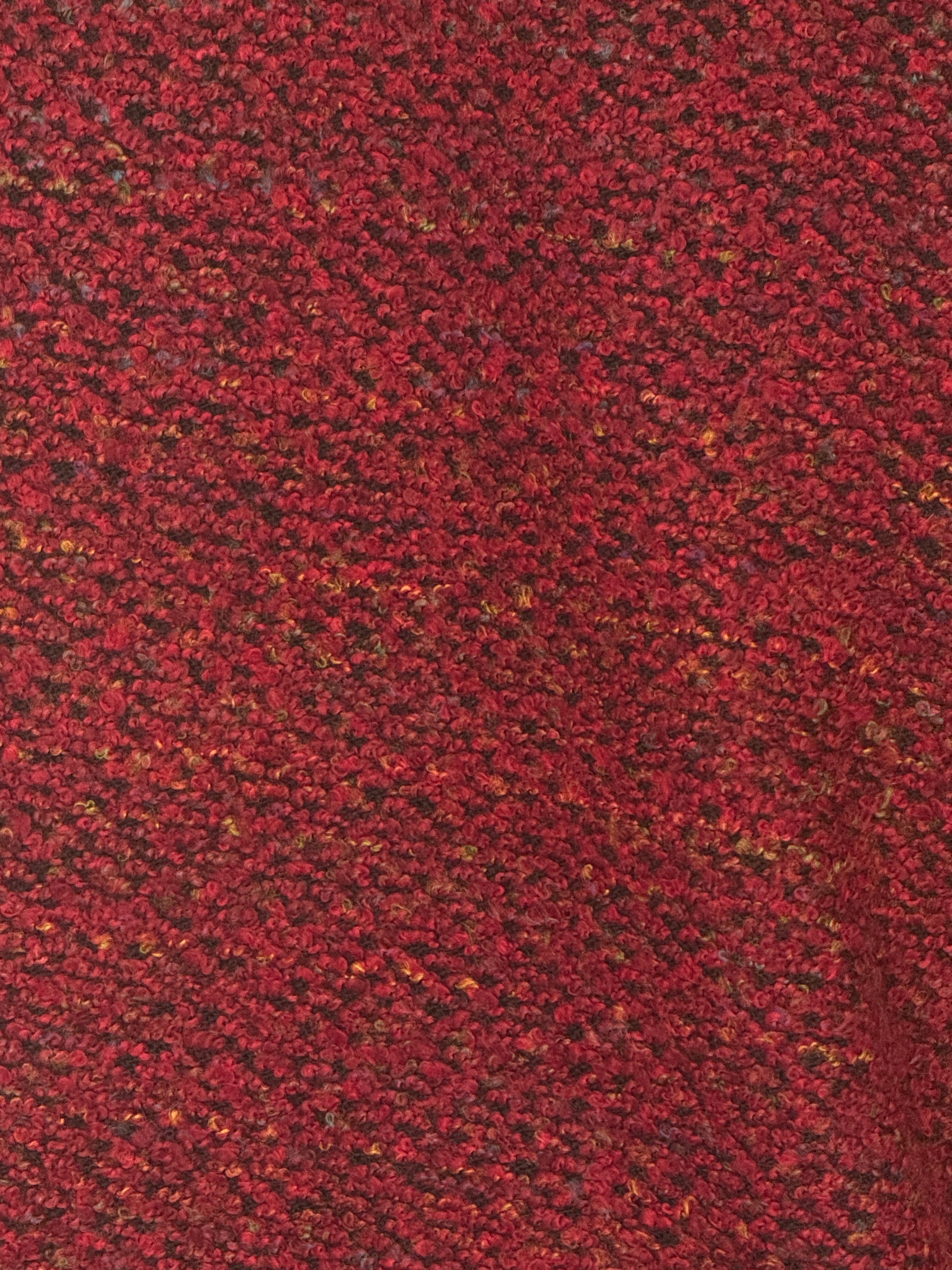 Vintage burgundy bouclé jacket fabric close-up