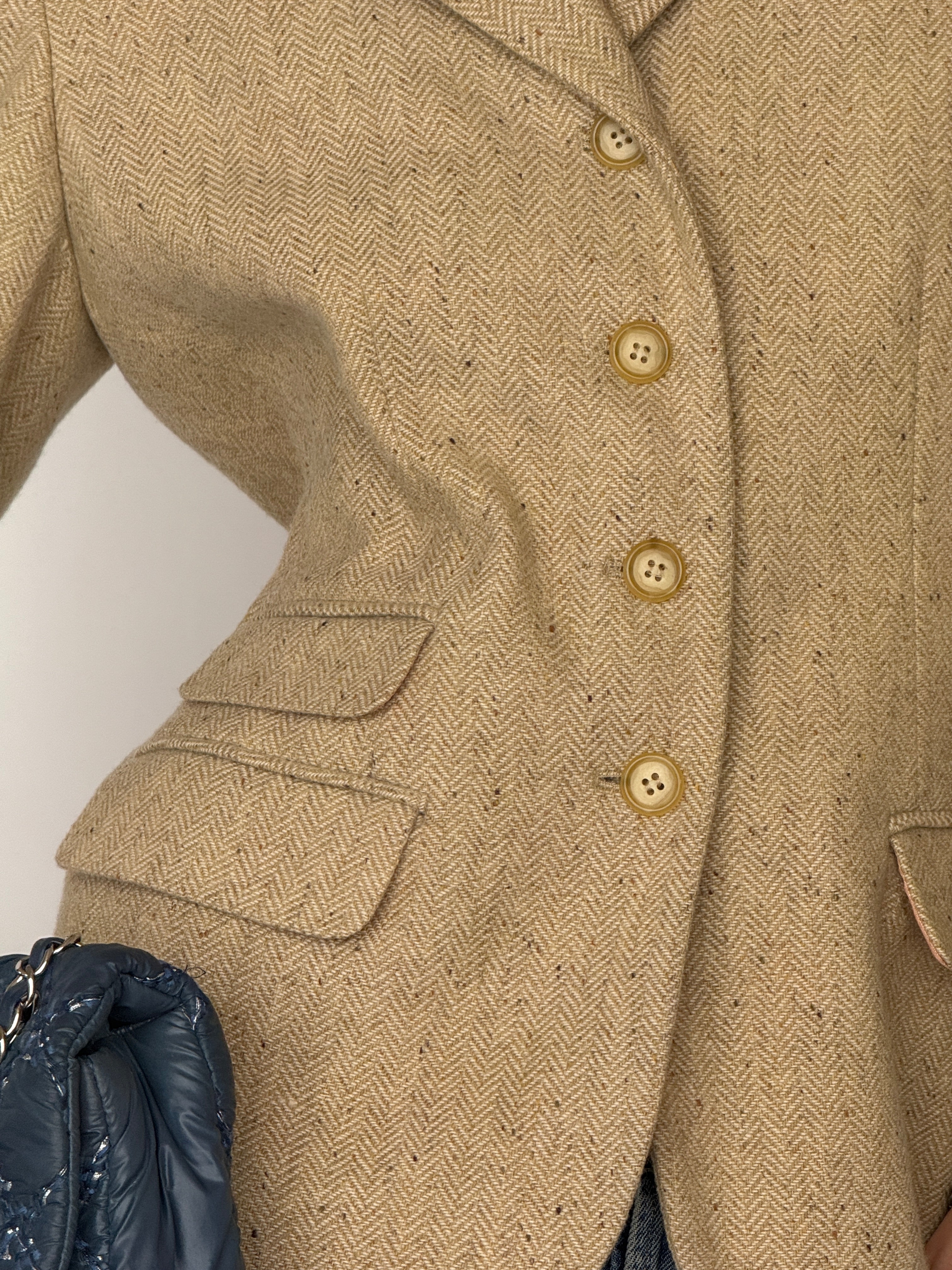 Vintage beige lambswool herringbone blazer fabric close-up