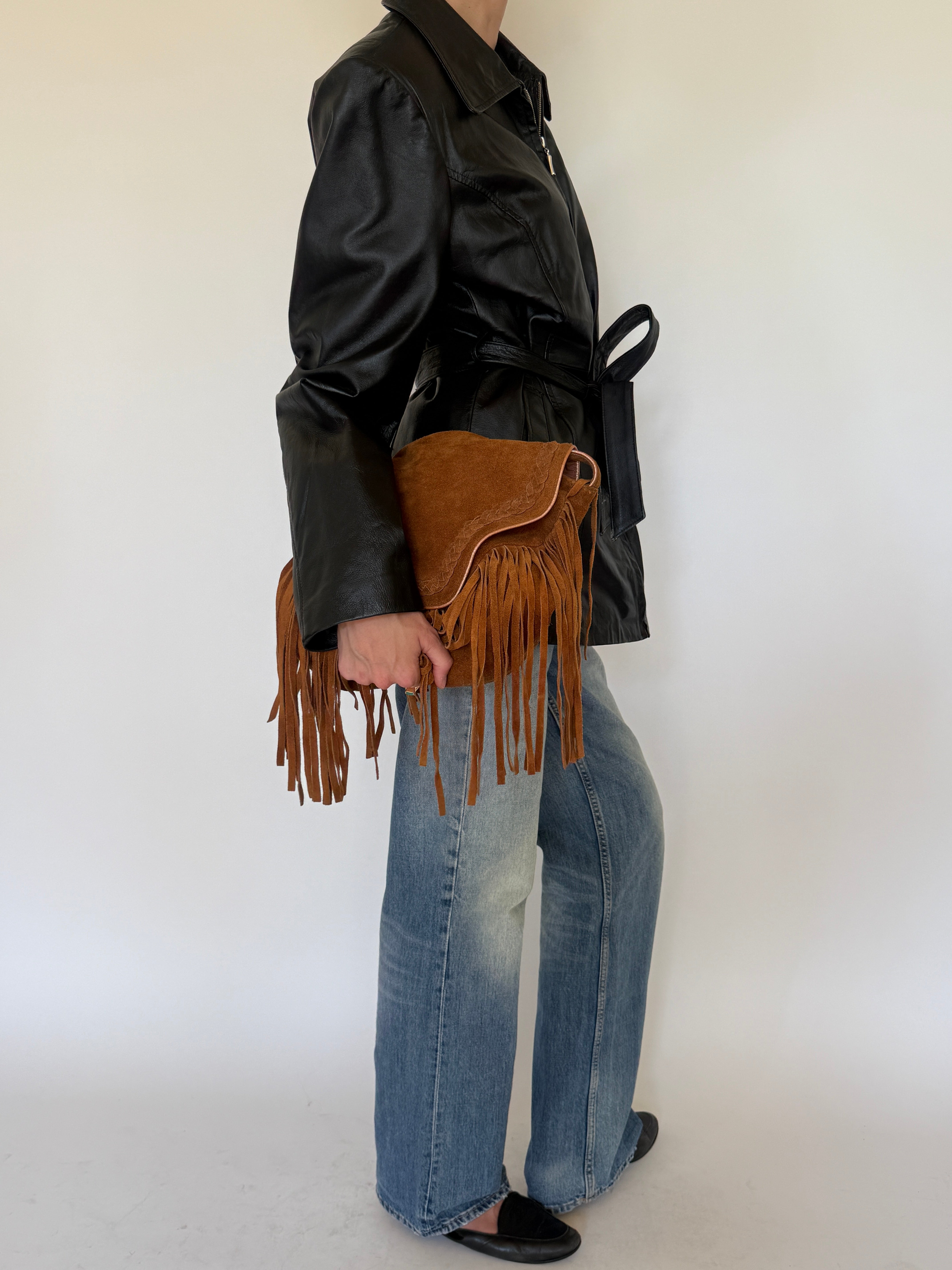 Vintage black belted leather jacket side view