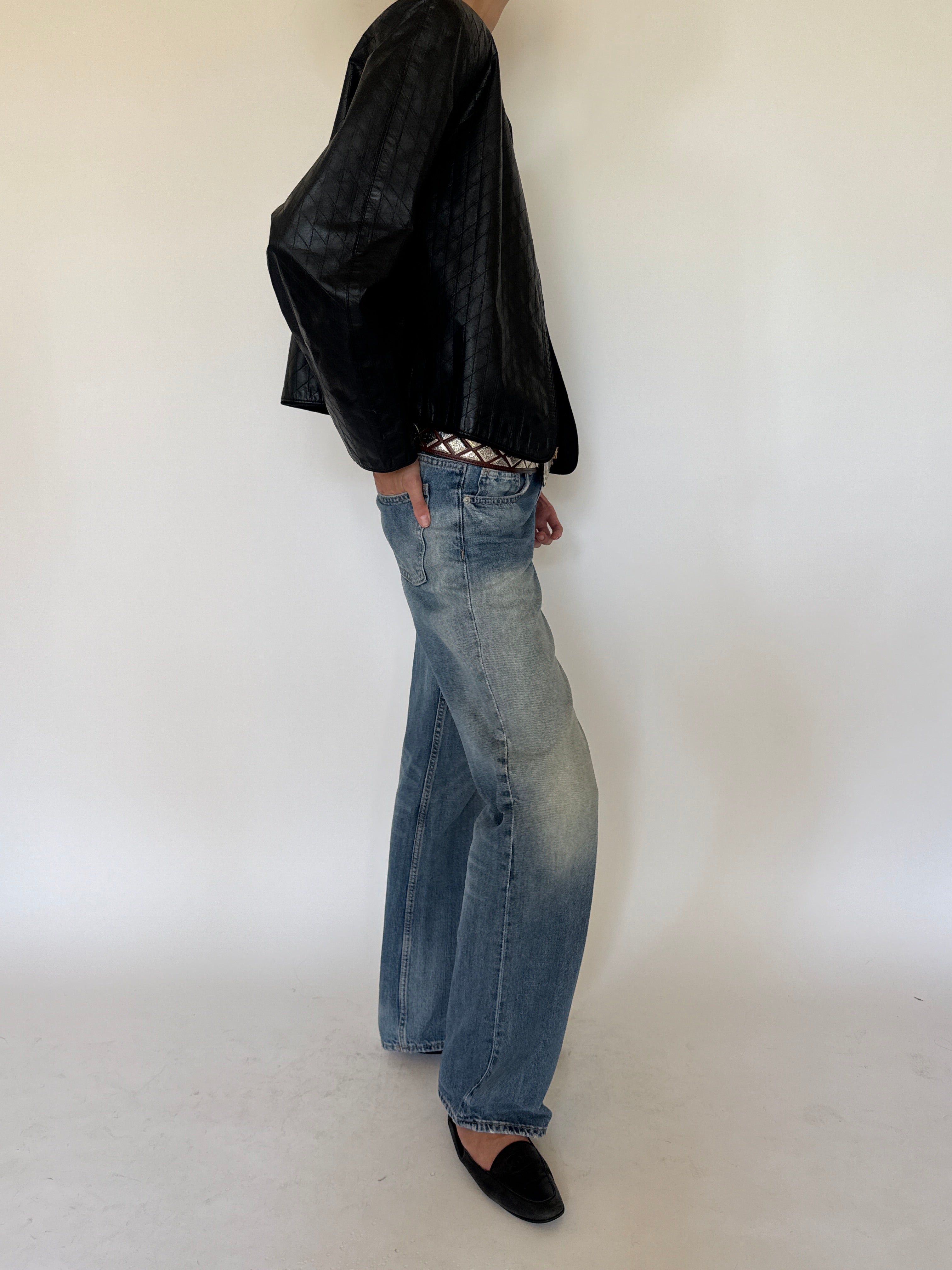 Vintage black quilted leather jacket side view