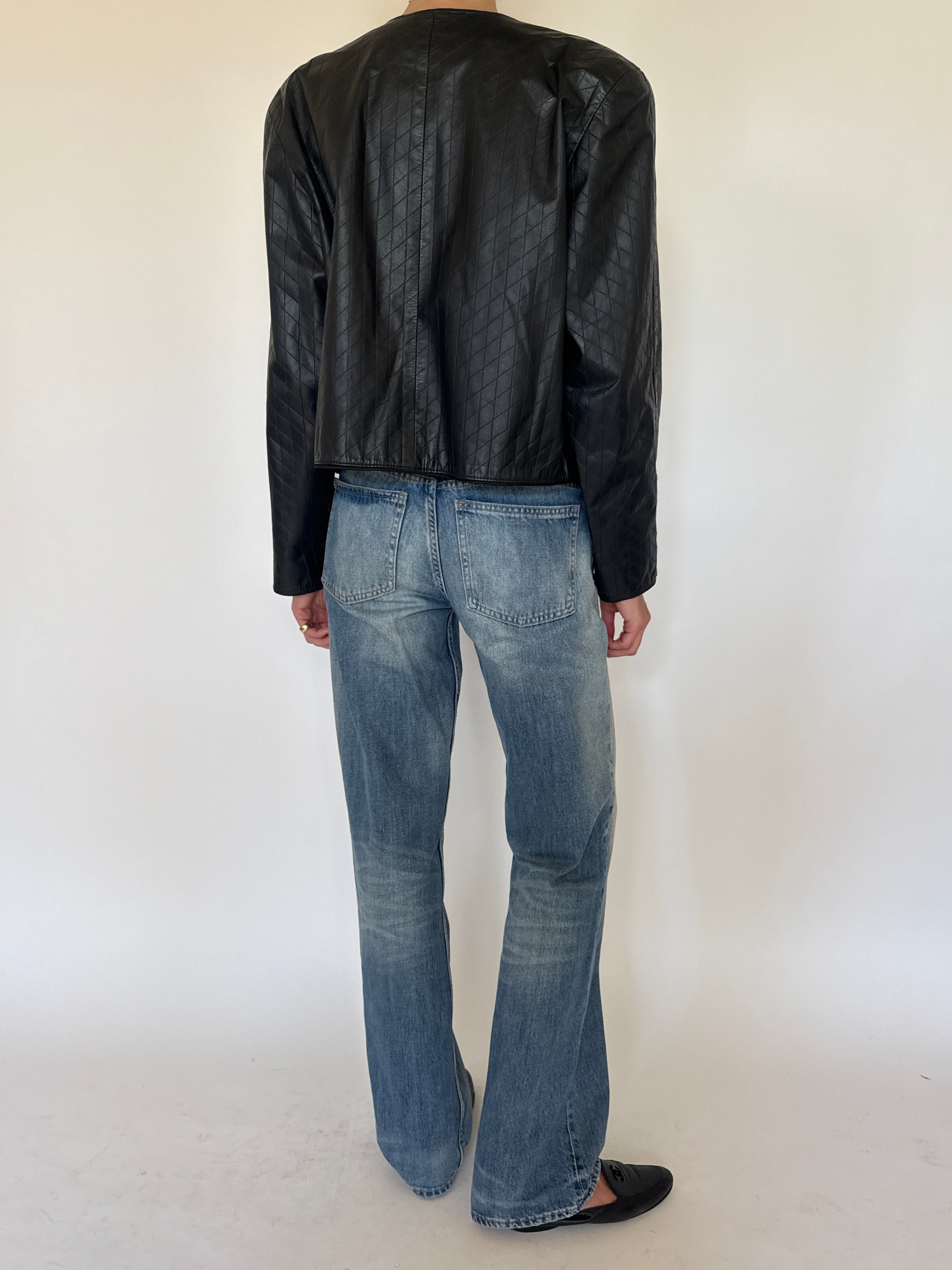 Vintage black quilted leather jacket back view